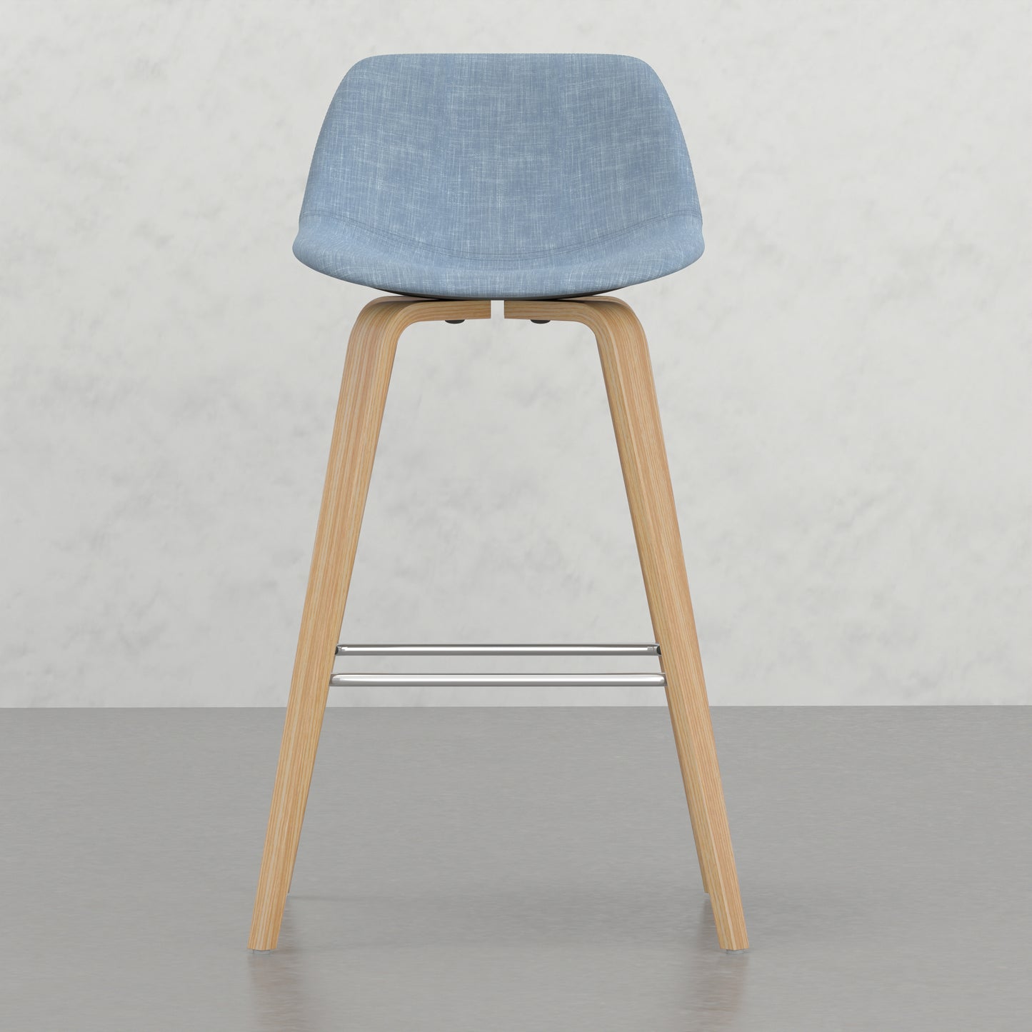Light blue fabric upholstered bar stool with natural wood legs and metal footrest