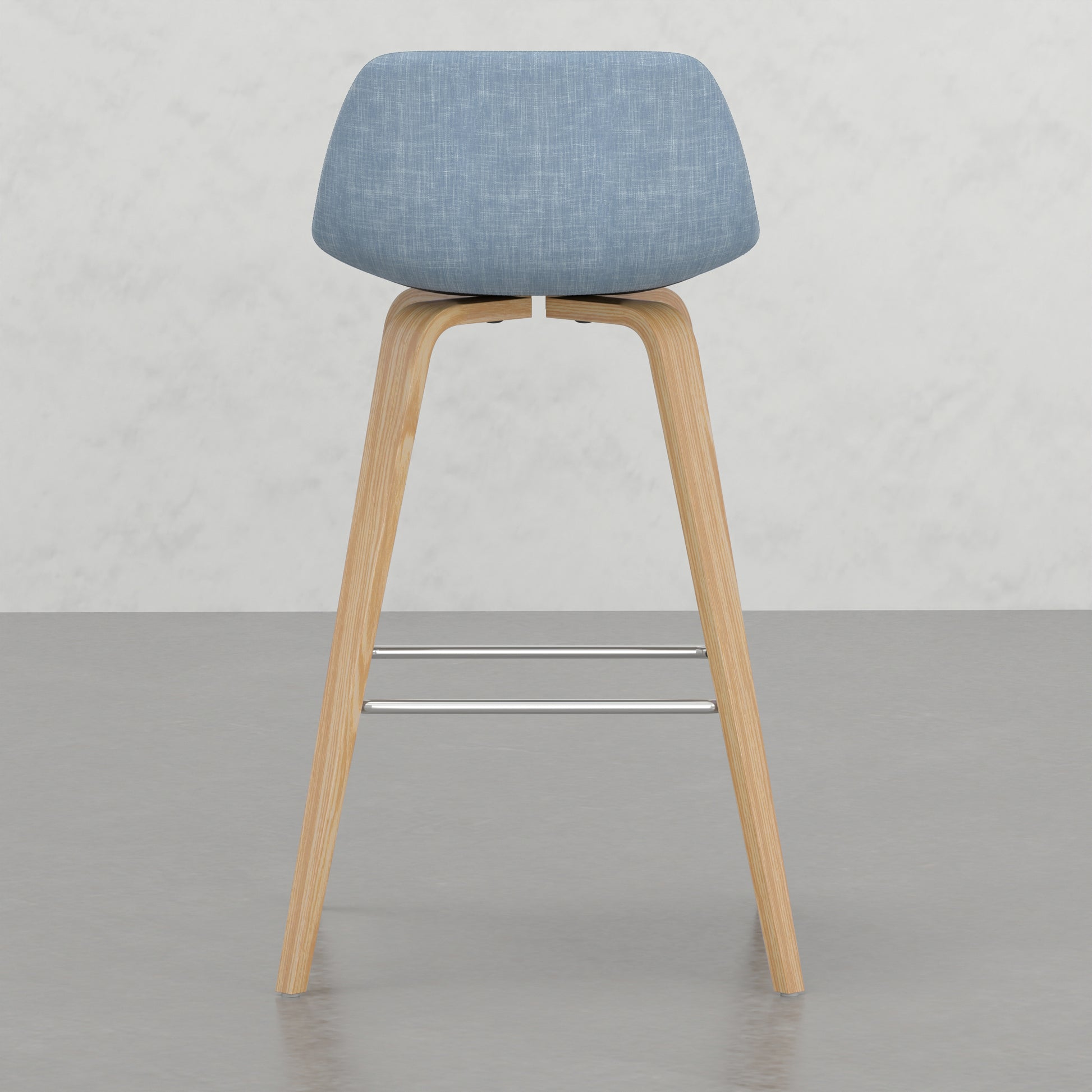 Blue fabric upholstered stool with natural wood legs