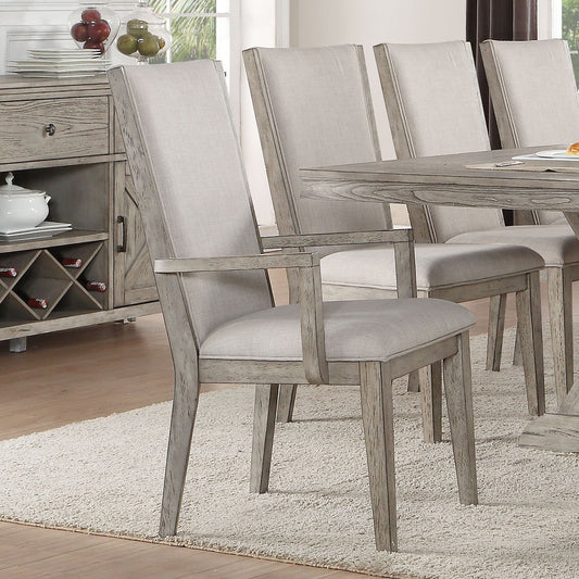 Upholstered dining chair with arms in light gray fabric and distressed wood frame