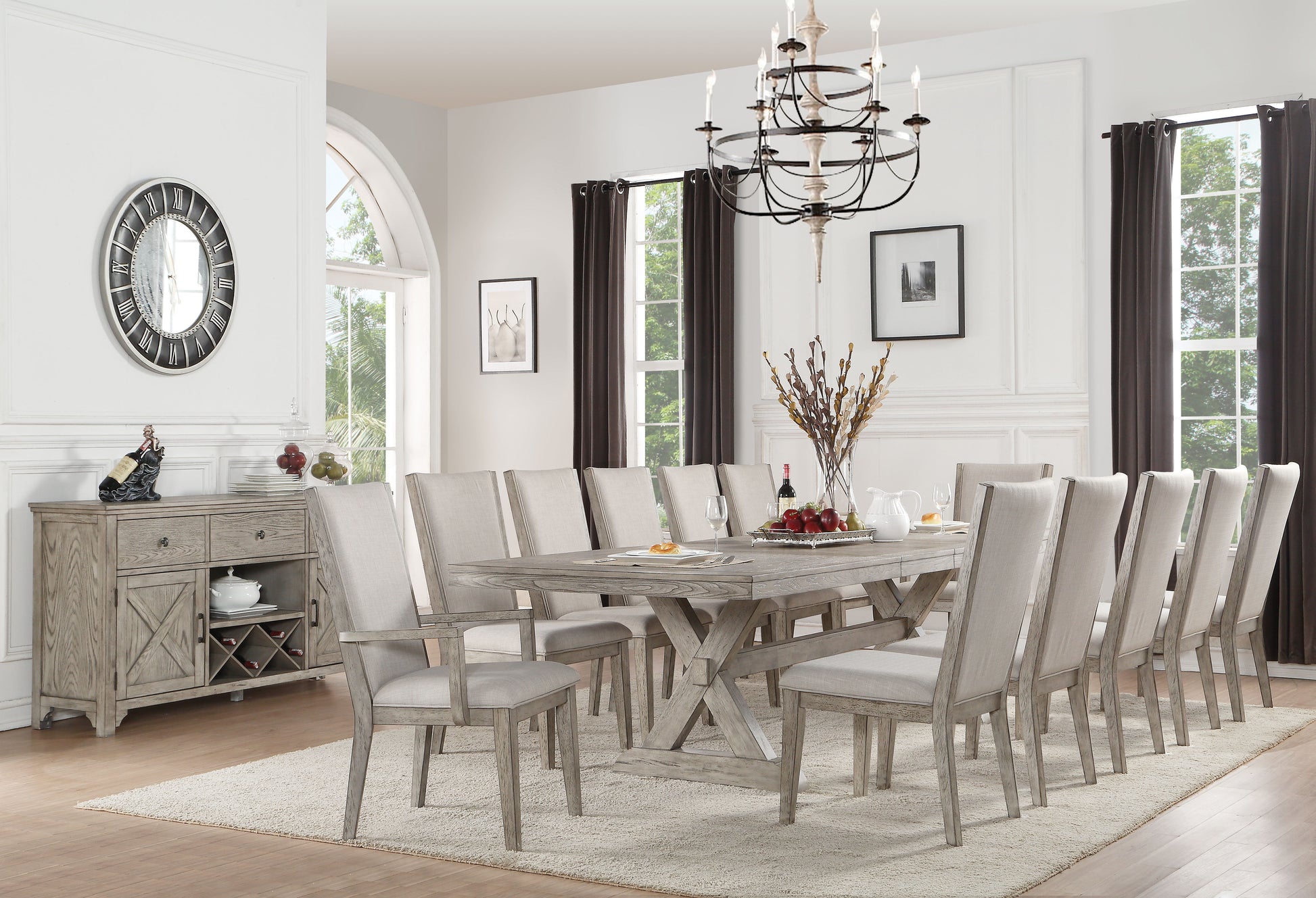 Rustic farmhouse dining table with a weathered oak finish and upholstered chairs seating eight