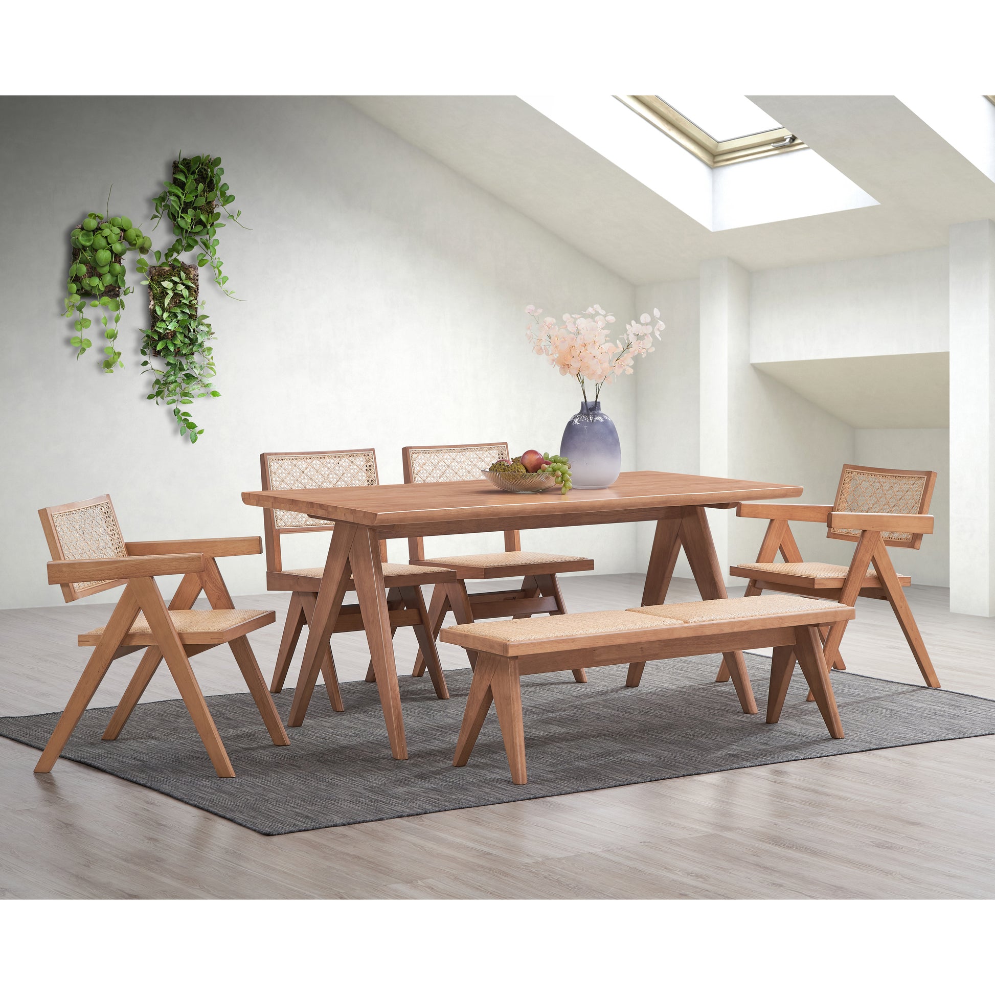 Natural wood dining table with woven seat chairs and bench