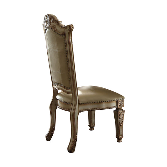 Ornate carved wood frame dining chair with tufted beige leather seat and back