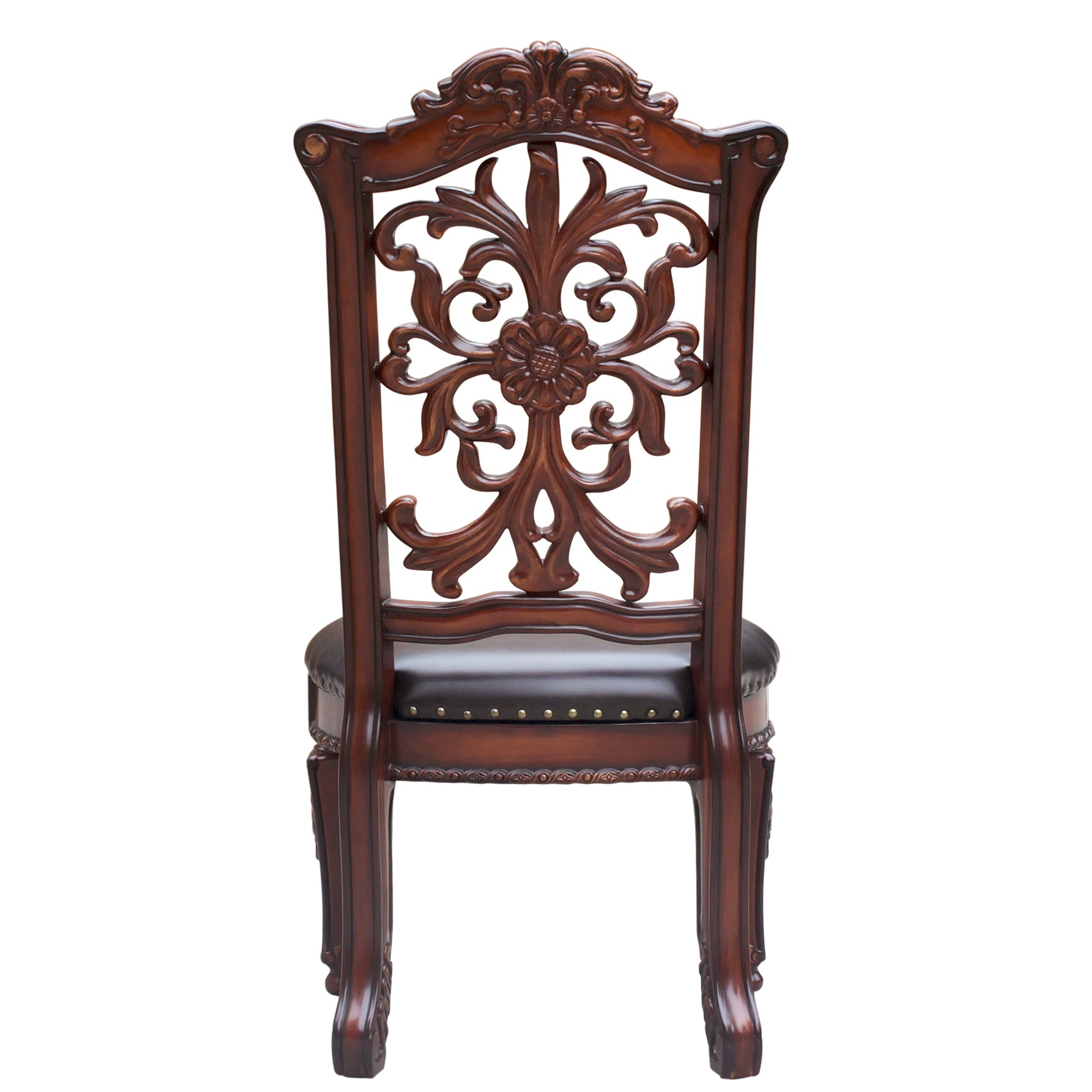 Ornate dark wood dining chair with carved floral backrest and brown leather seat