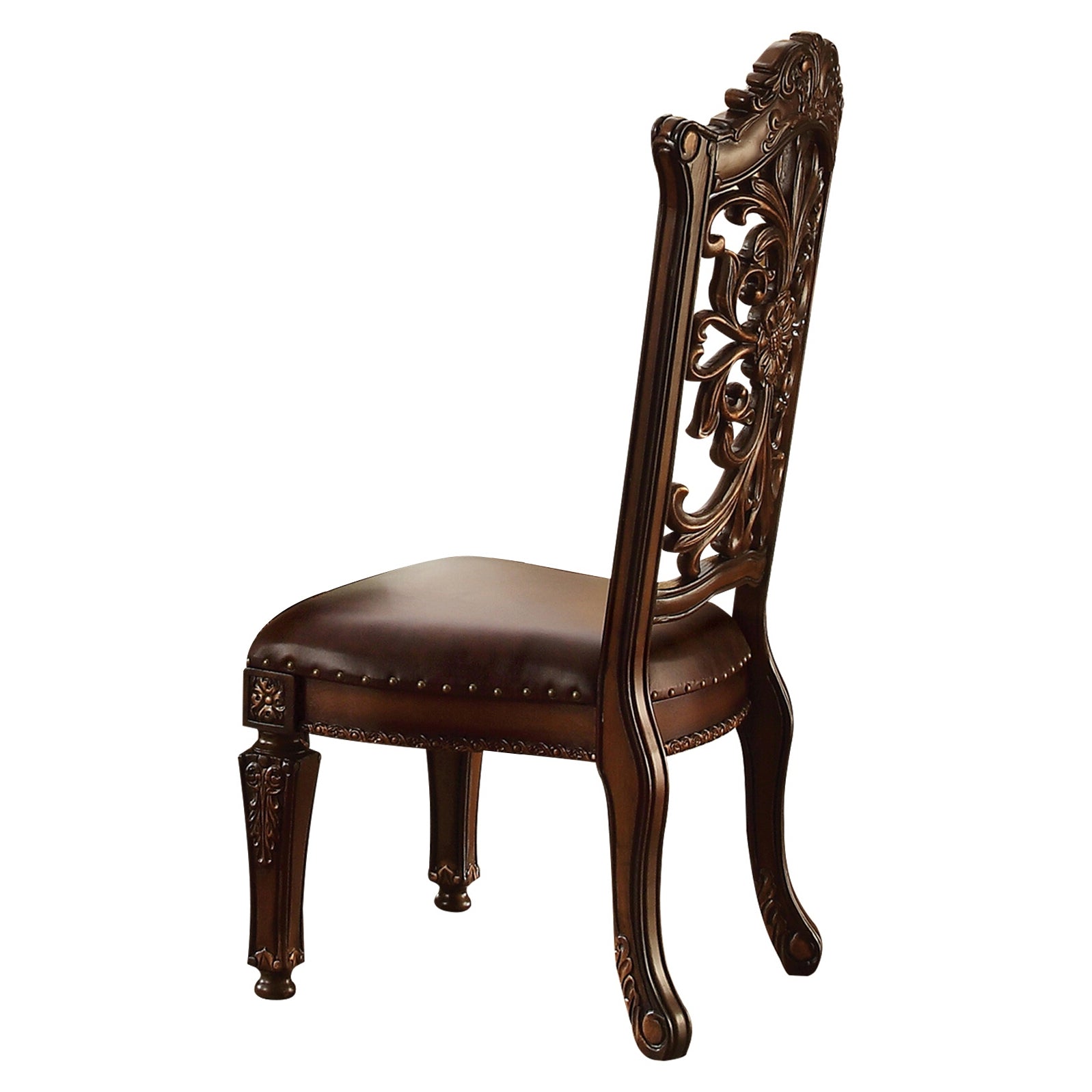 Ornate dark brown wood dining chair with carved back and leather seat