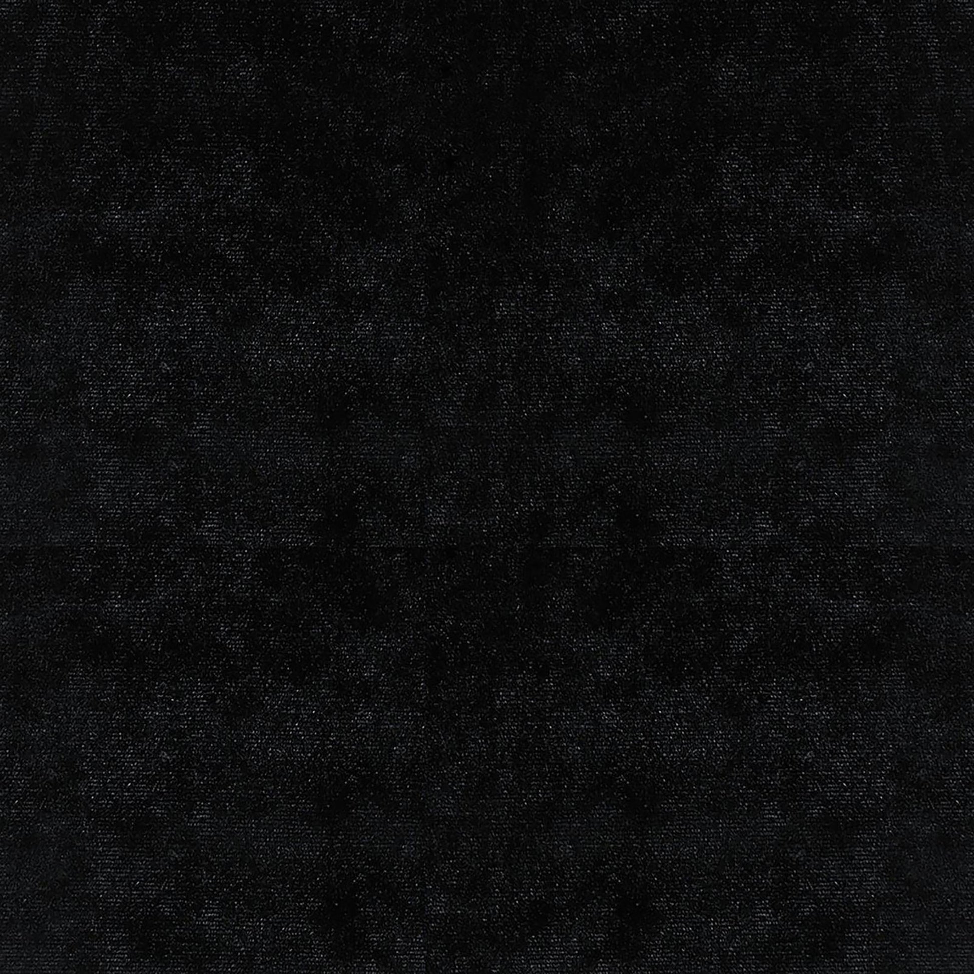 Luxurious black velvet fabric with a subtle sheen for elegant upholstery