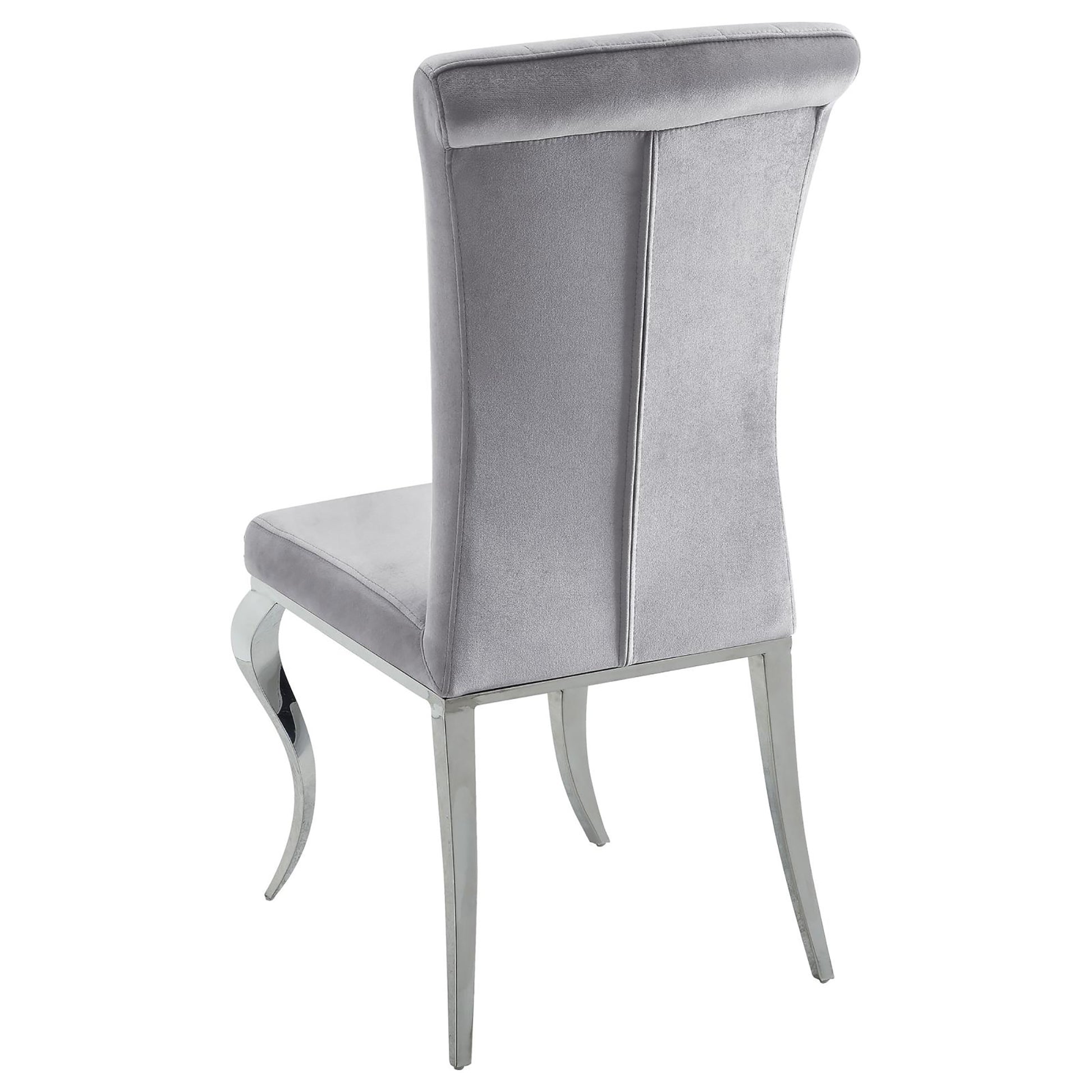Elegant grey velvet dining chair with polished chrome legs and elegant curved design