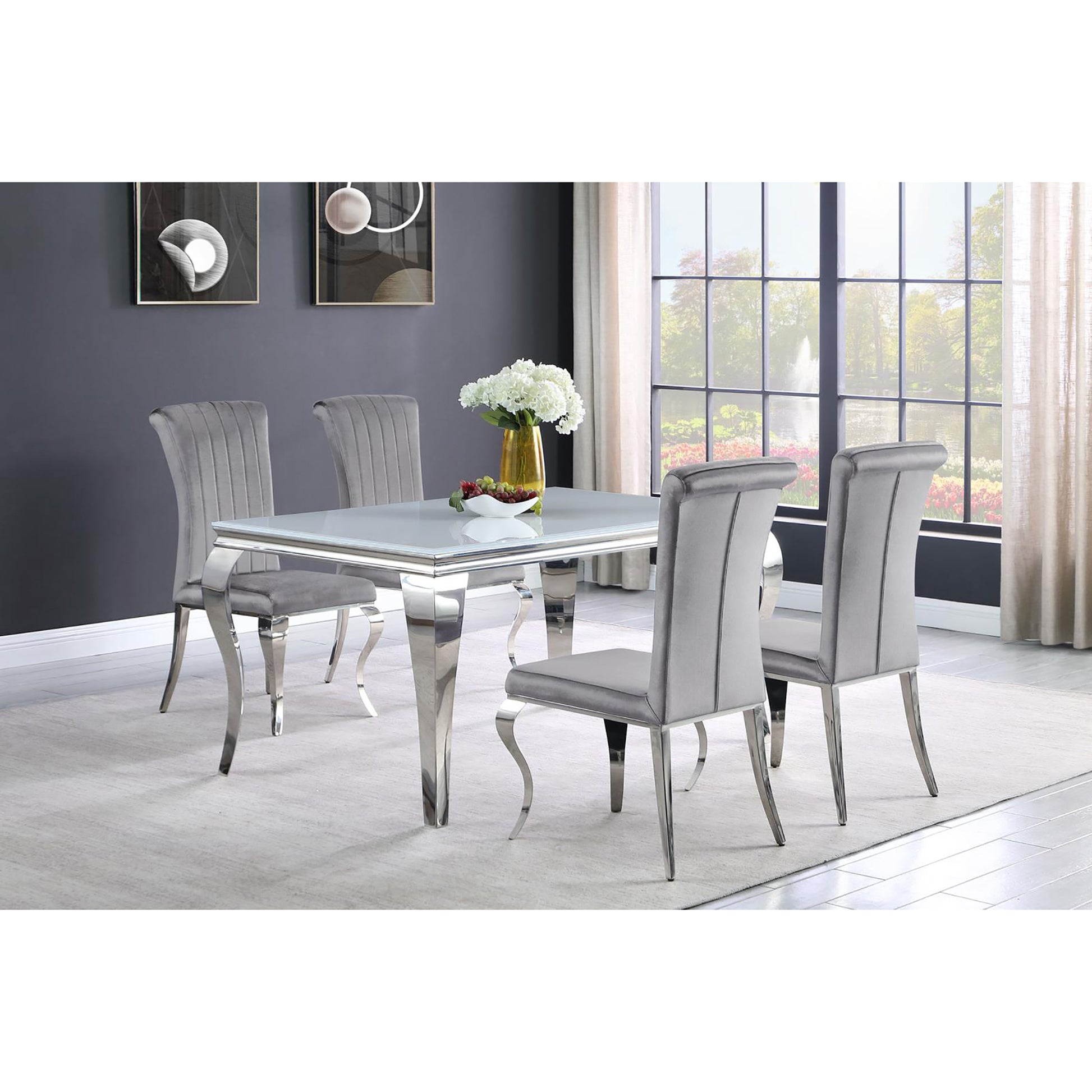 Modern gray velvet dining chairs with chrome legs and fluted backs