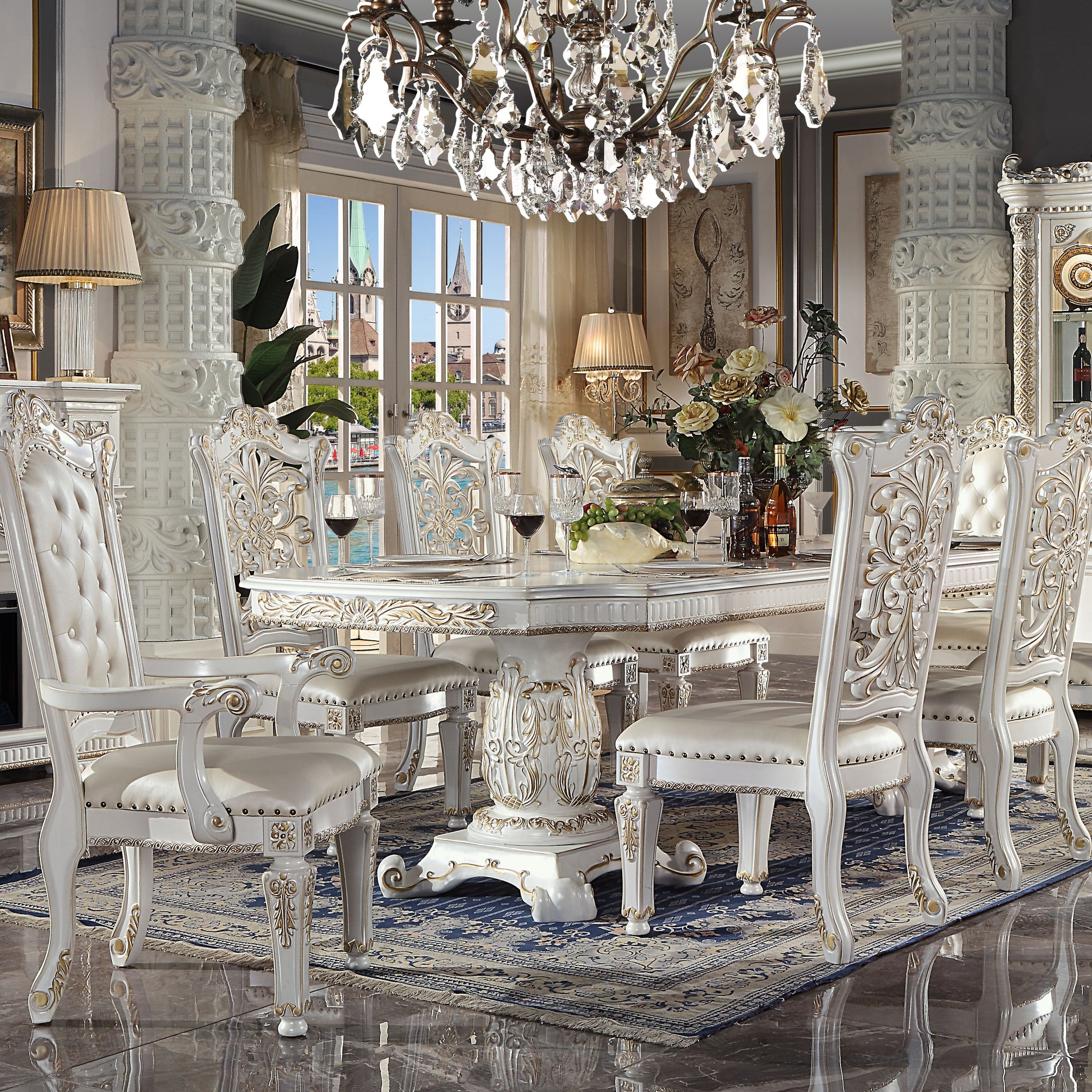 Elegant white tufted dining chair with gold accents and ornate carvings part of a formal dining set