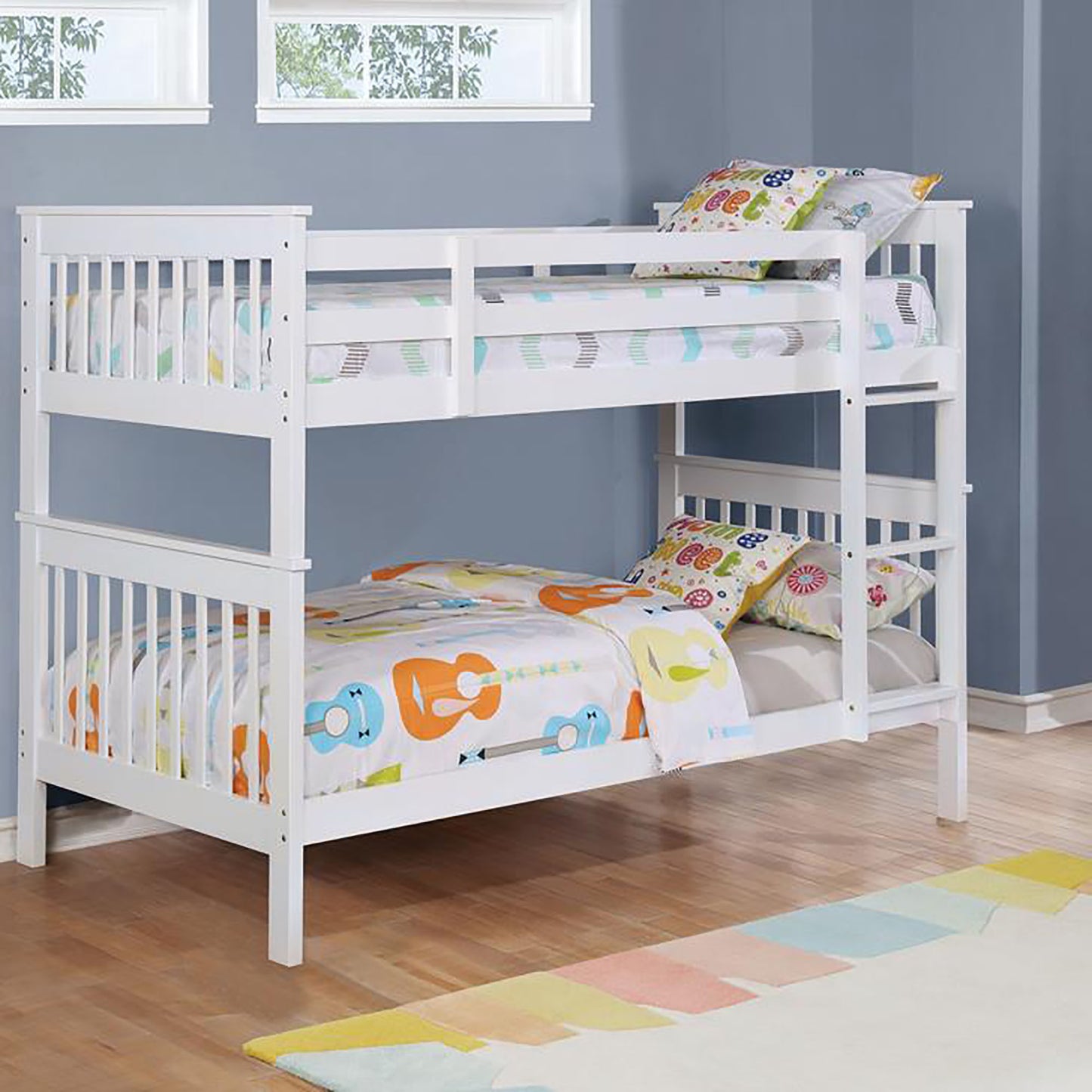 White wooden twin over twin bunk bed with playful guitar print bedding
