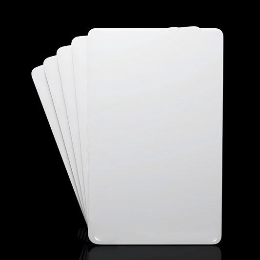 Five blank white plastic cards fanned out perfect for loyalty programs or gift cards