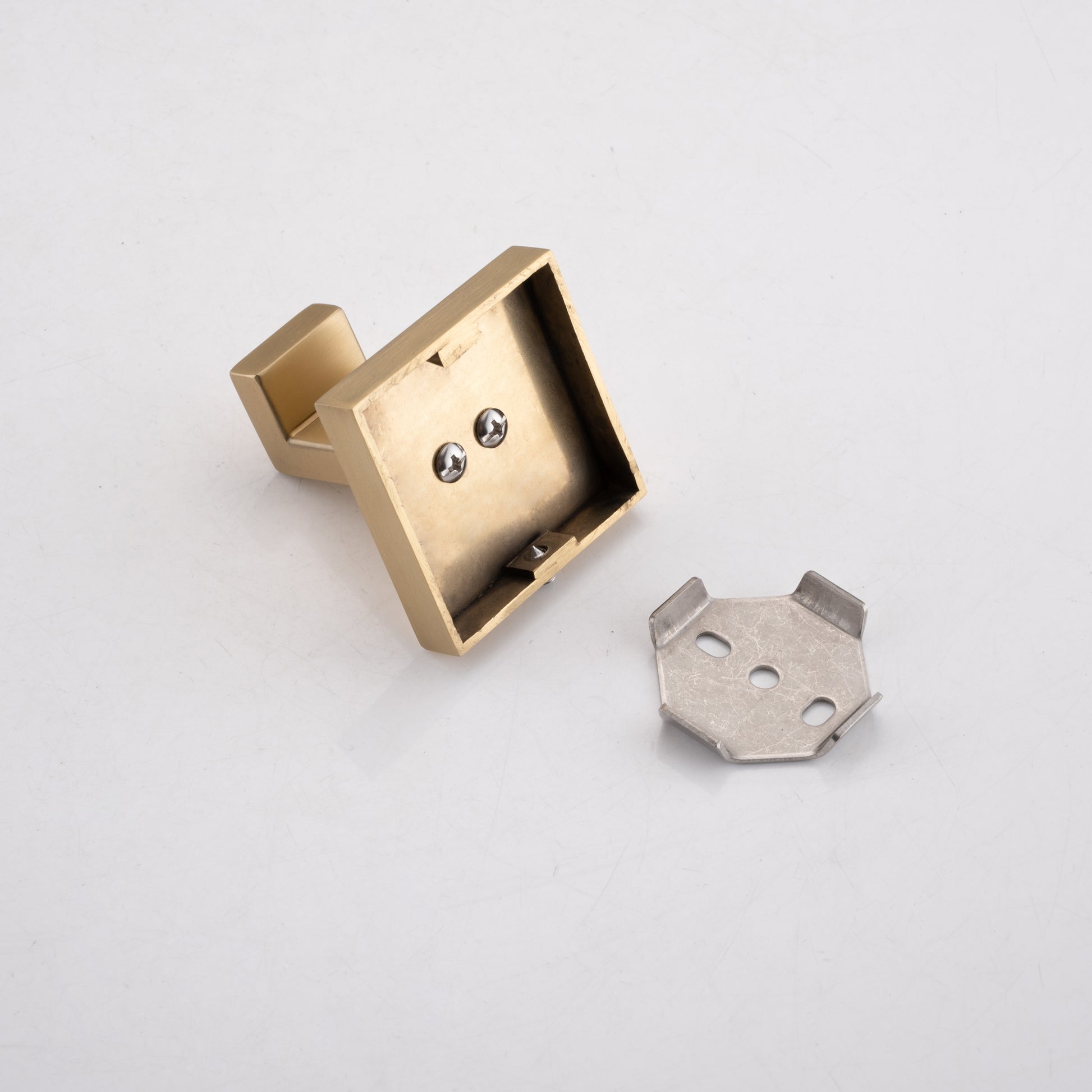 Brushed brass toilet paper holder base with screws and mounting bracket