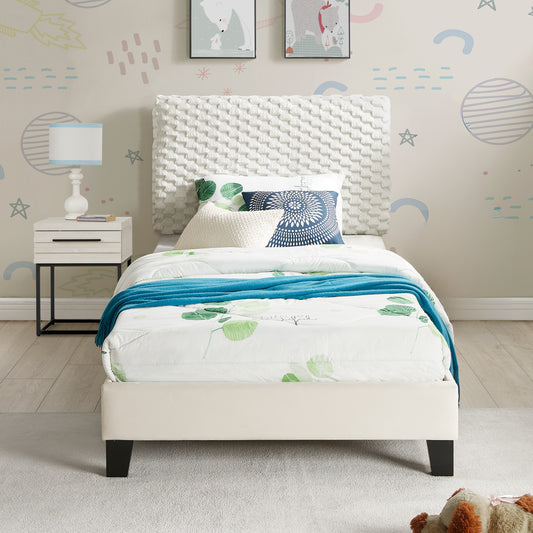 Cream upholstered twin bed with textured white headboard and botanical print bedding