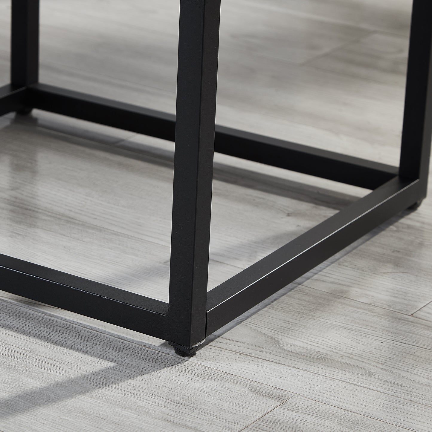 Black metal table legs with floor protectors