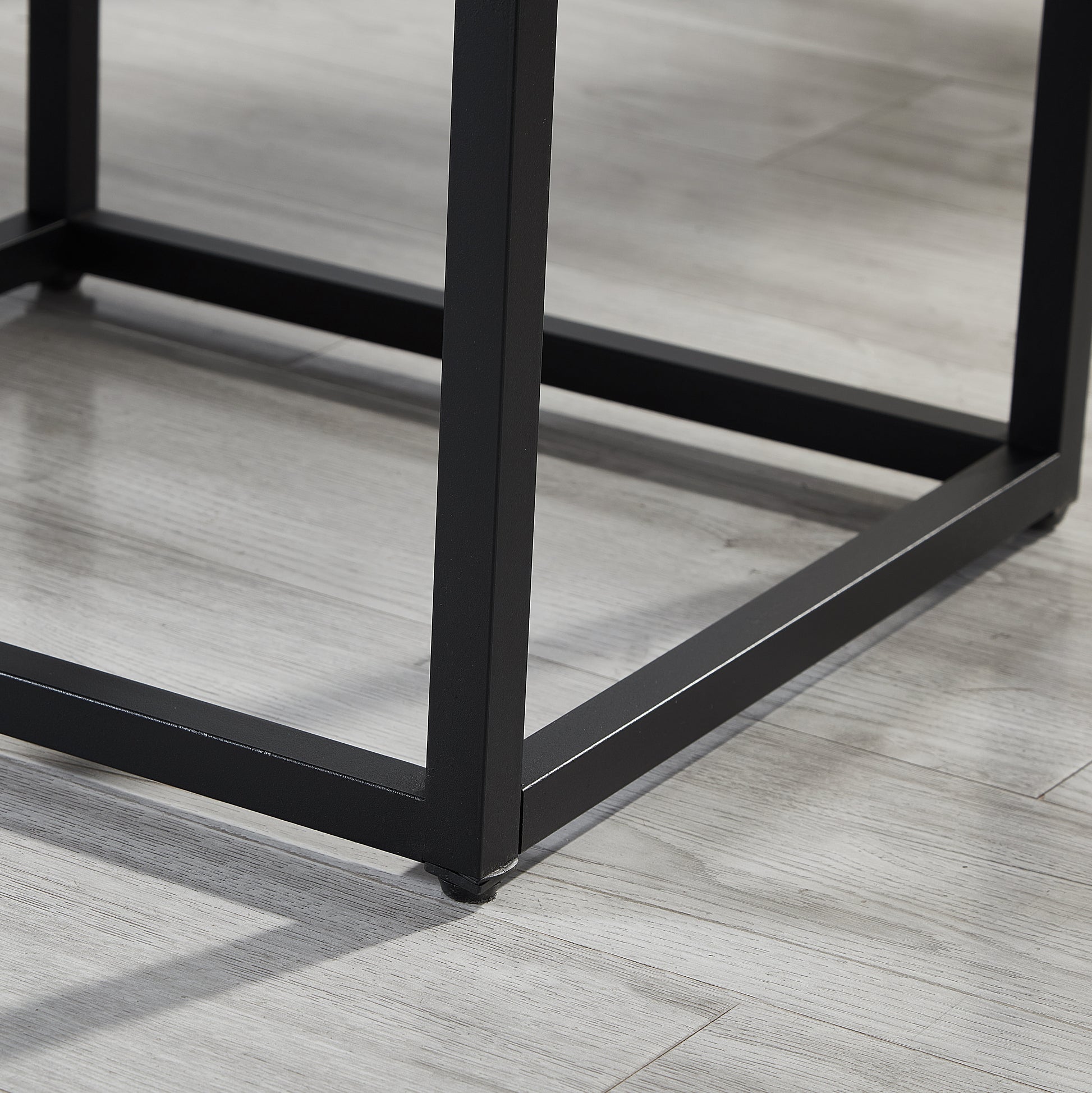 Black metal table legs with floor protectors