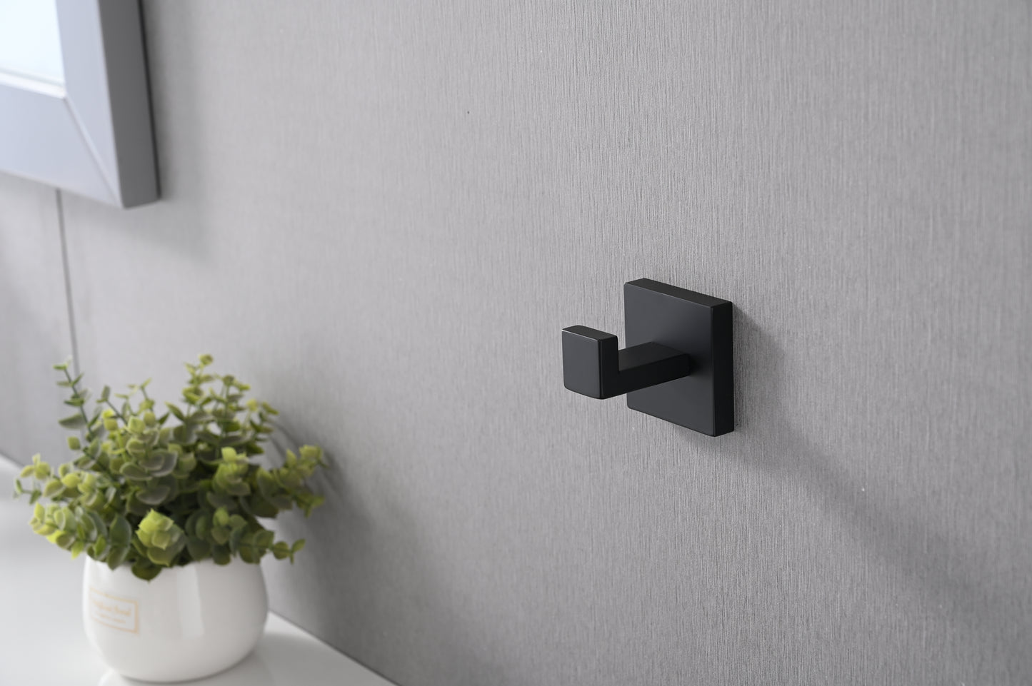 Modern black metal wall hook with a minimalist square base for bathrooms
