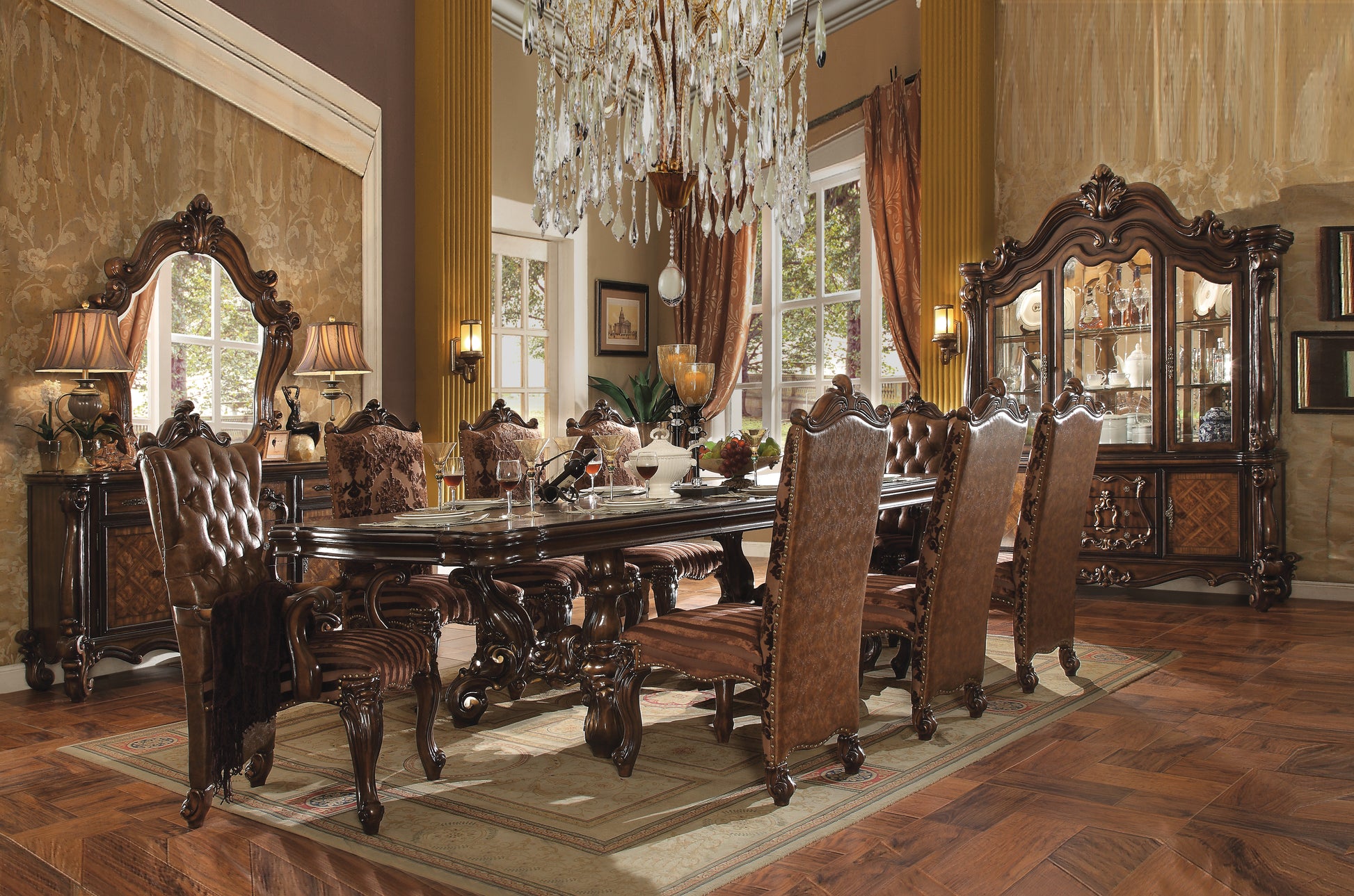 Ornate mahogany dining table with tufted leather chairs set for a formal meal
