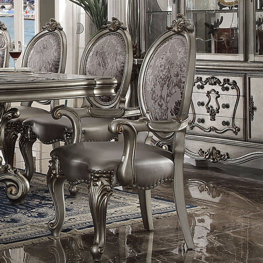 Ornate silver dining chair with upholstered grey damask seat and back