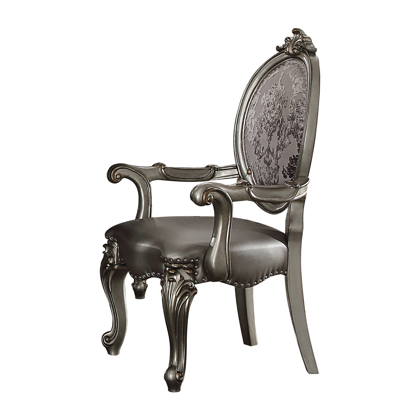 Ornate silver carved armchair with dark upholstered seat and detailed floral backrest