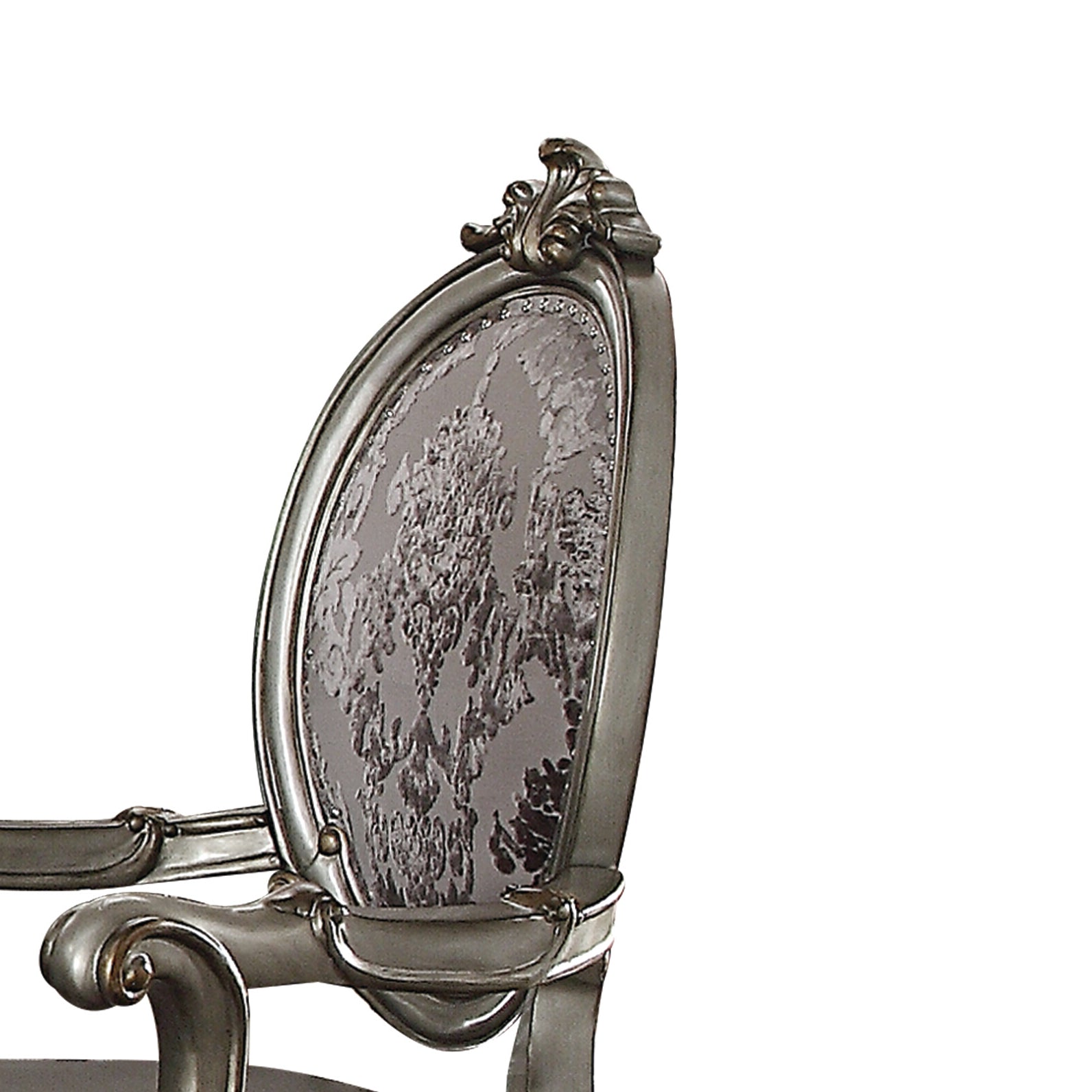Ornate silver accent chair with damask upholstered back and detailed carving for elegant living rooms