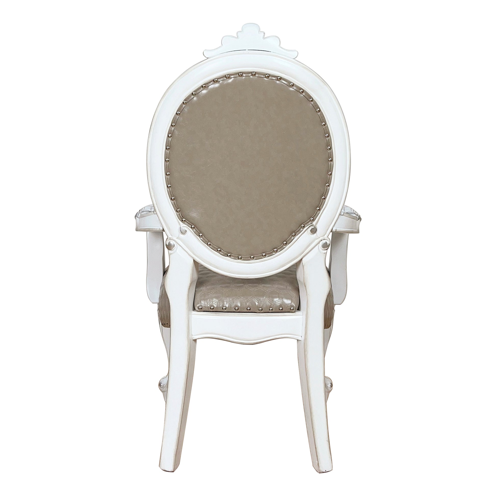 Antique white upholstered armchair with tufted seat and decorative nailhead trim