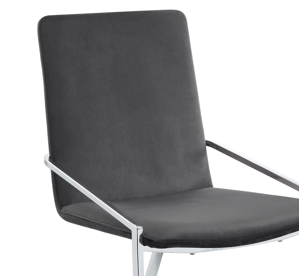 Closeup of a charcoal grey upholstered chair with a sleek chrome frame