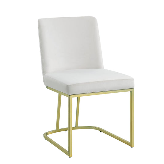 White velvet dining chair with sleek gold metal base