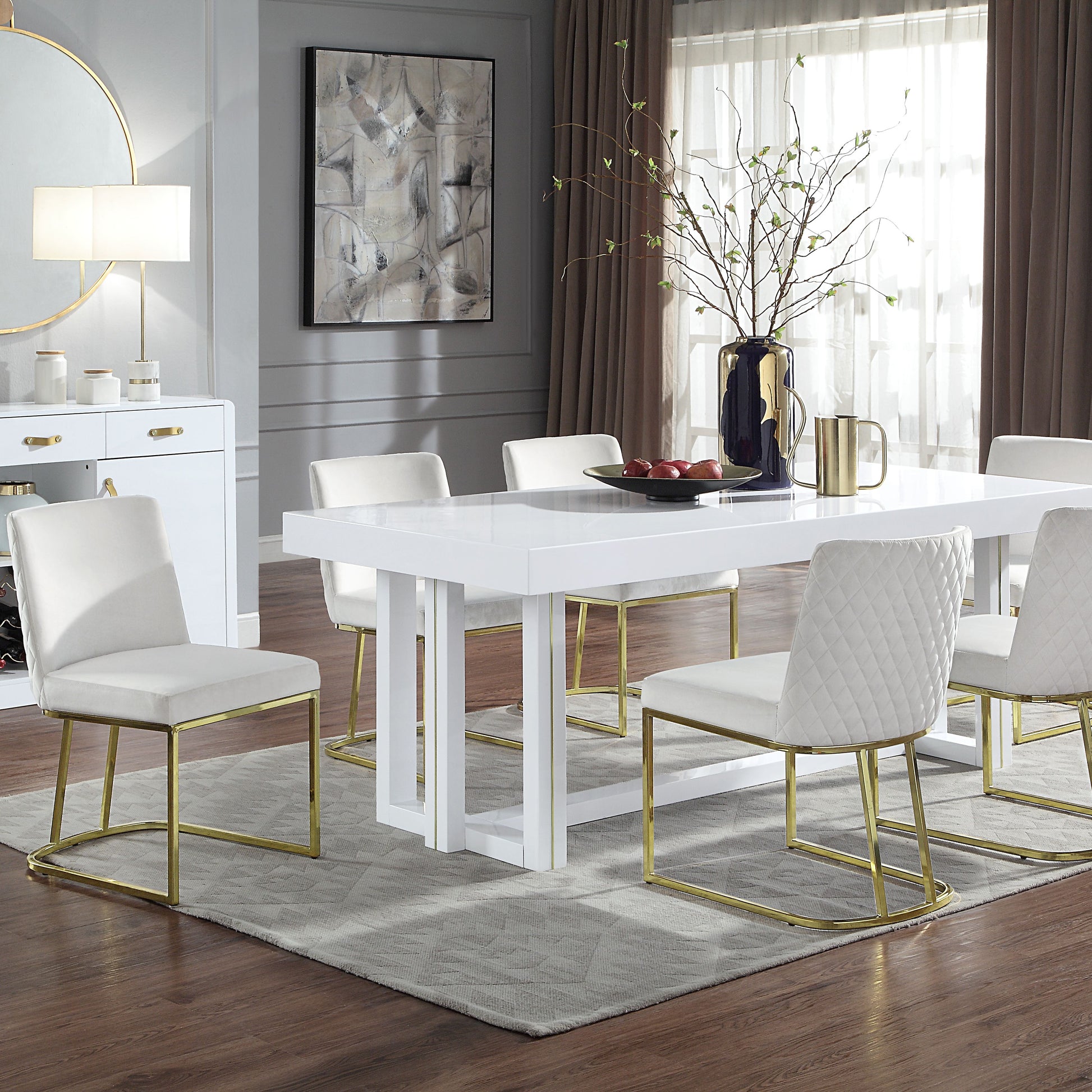 White gloss dining table with gold metal frame chairs and tufted upholstery