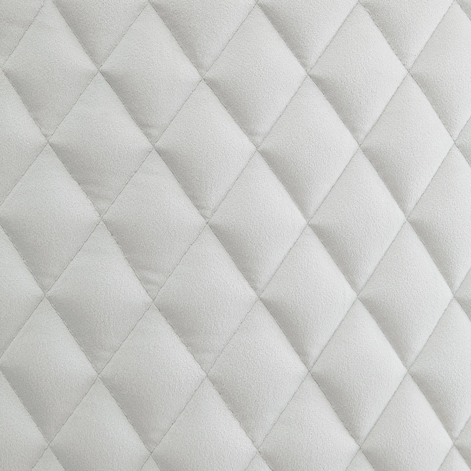 Soft white diamond quilted upholstery fabric detail perfect for furniture