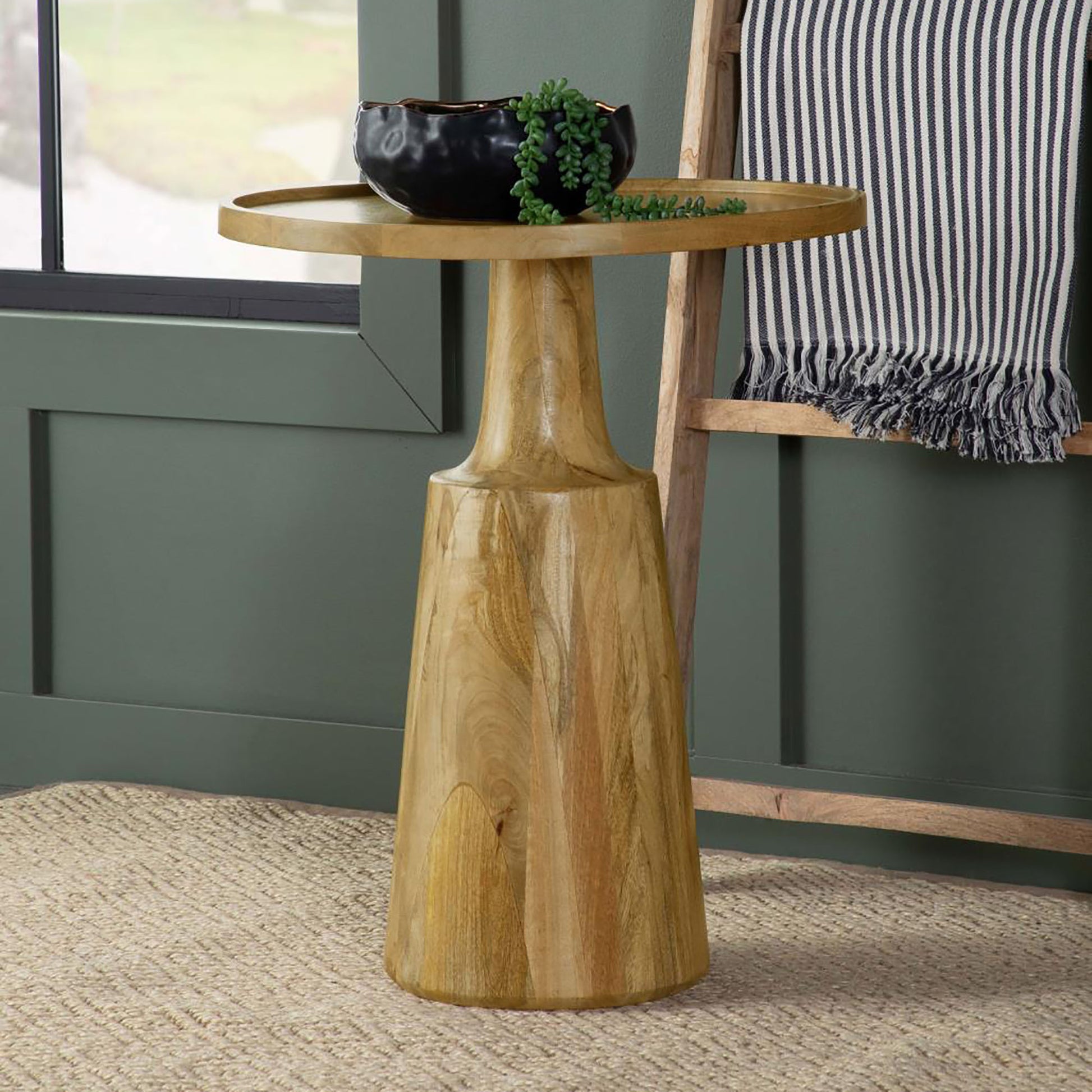 Tall natural wood accent table with carved pedestal base and round tray top