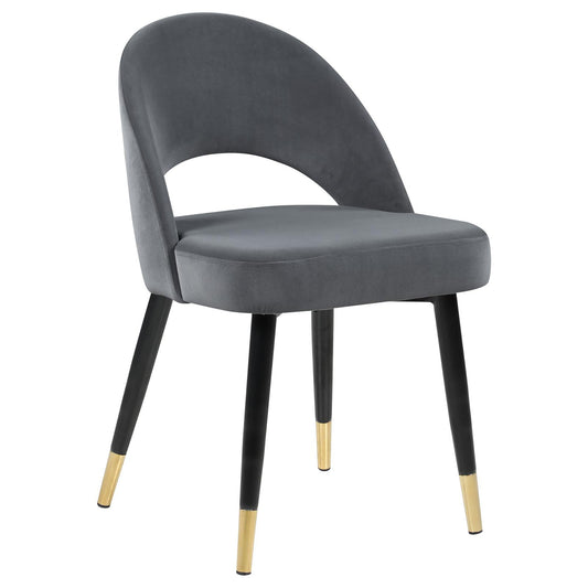 Grey velvet accent chair with open back and goldtipped black legs