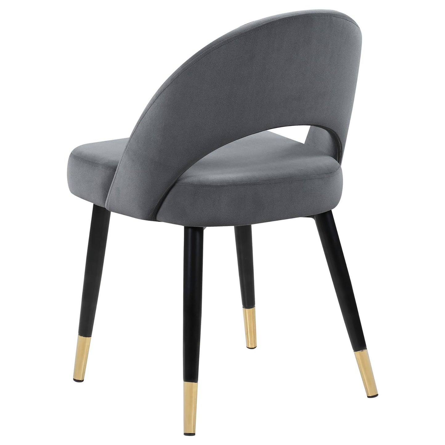 Grey velvet accent chair with black tapered legs and gold caps