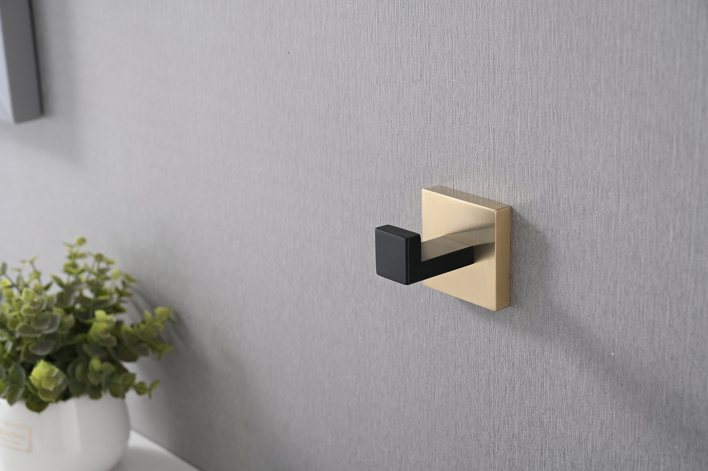 Modern matte black and brushed gold wall hook for entryway organization