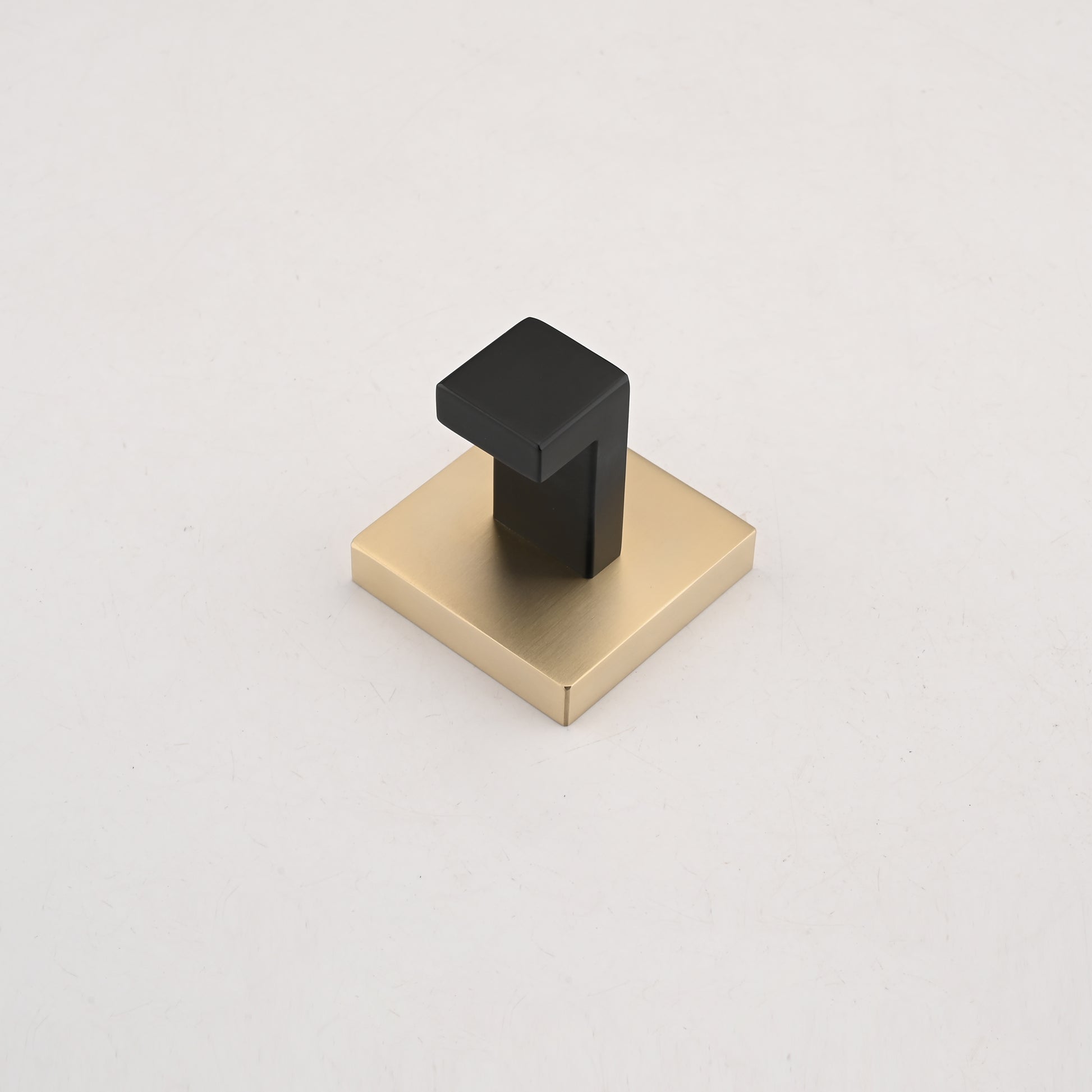 Modern black and brass cabinet knob with minimalist design