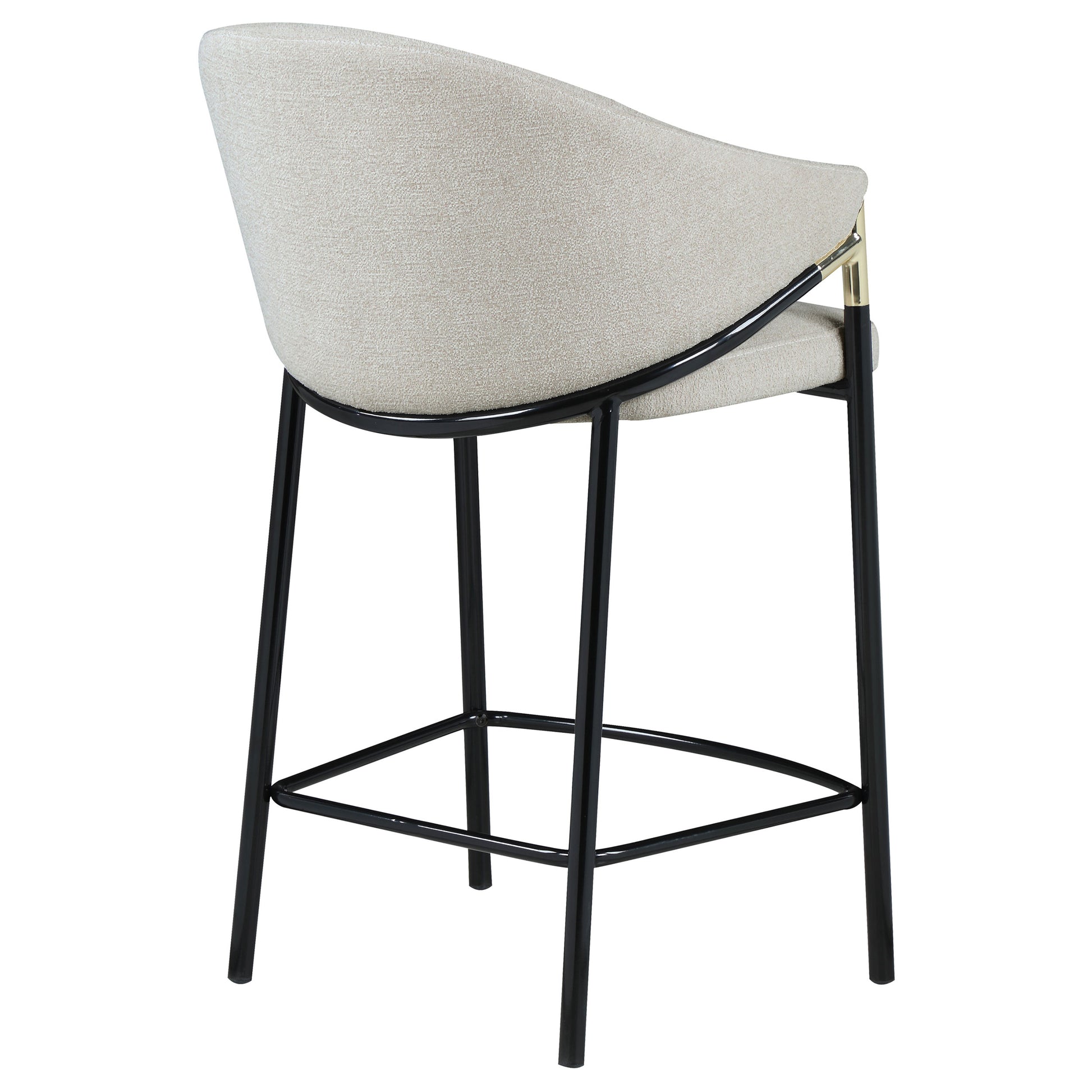 Light beige textured fabric counter stool with black metal legs and gold accents