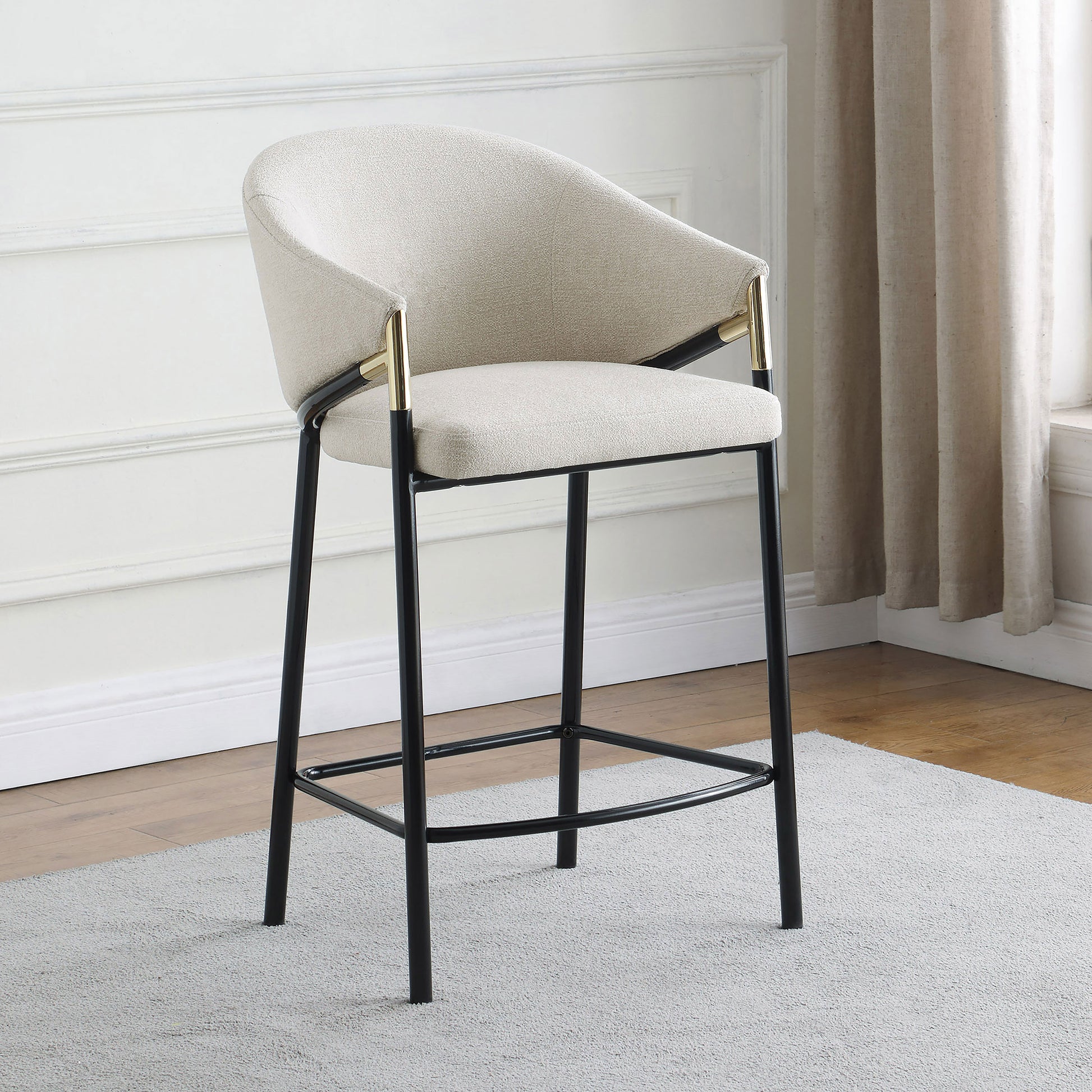Textured cream boucle bar stool with gold accents and black metal legs