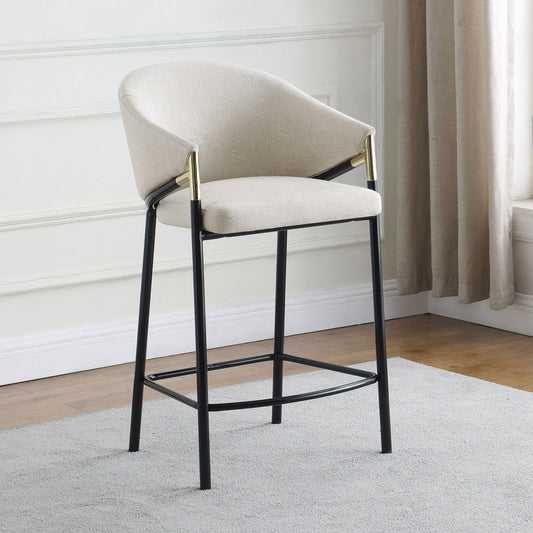 Textured cream boucle bar stool with gold accents and black metal legs