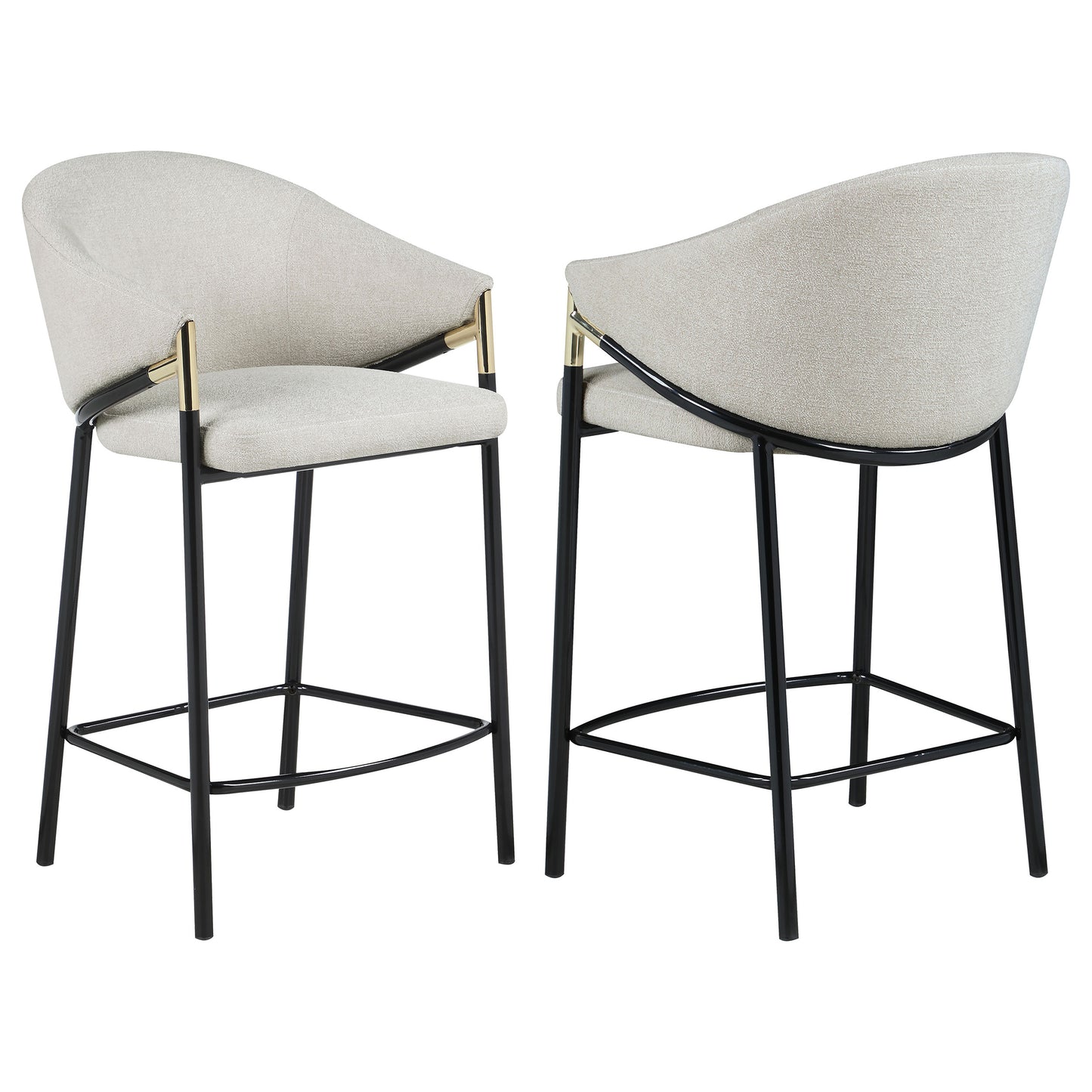 Two upholstered bar stools in a light neutral tone with black metal legs and gold accents