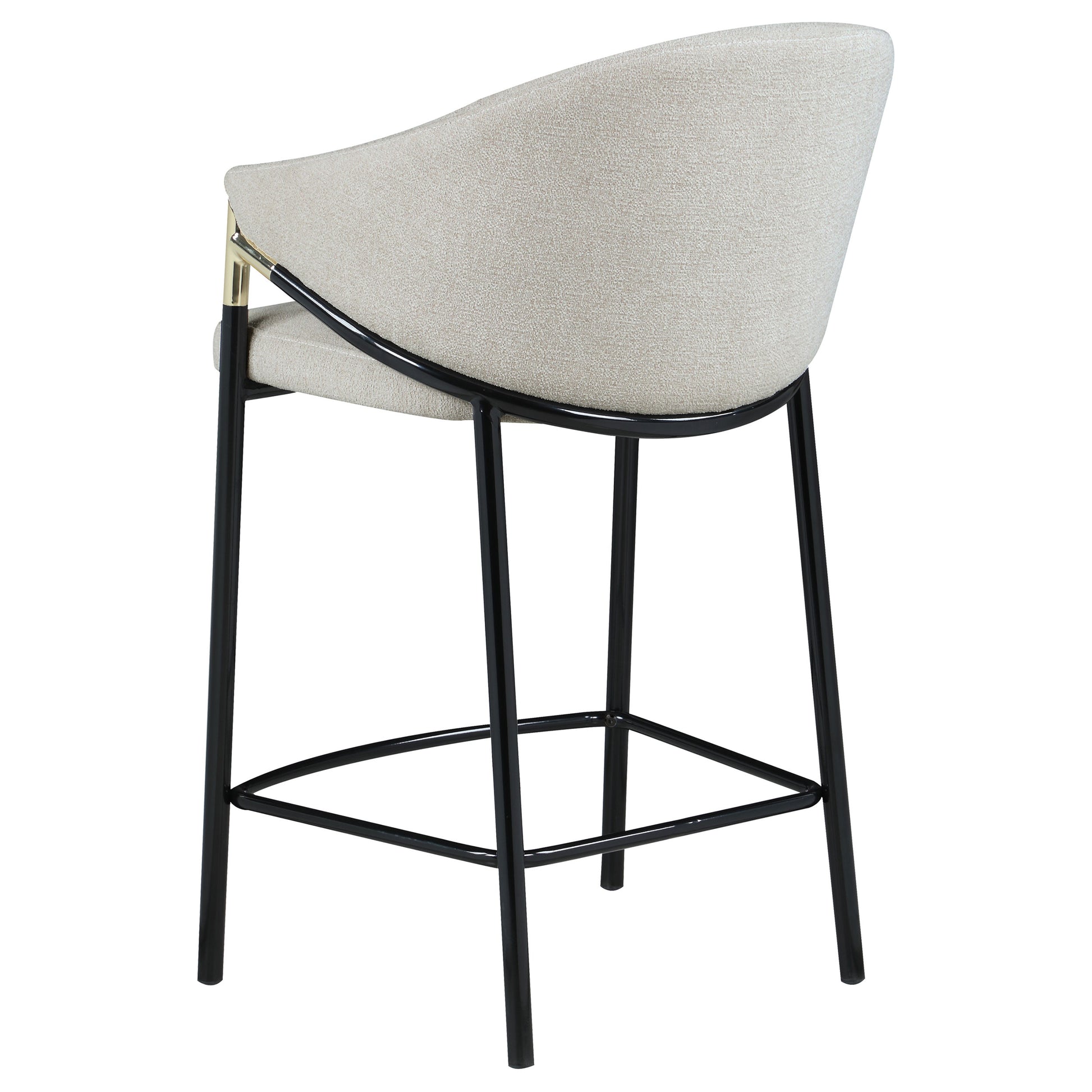 Textured cream fabric counter stool with black metal legs and gold accents