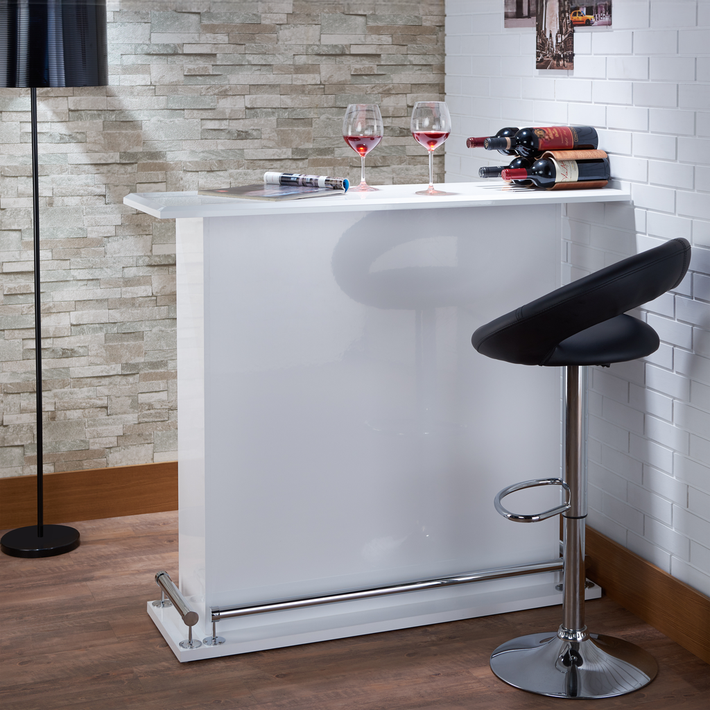 Sleek white modern bar with black leather stool wine bottles and glasses