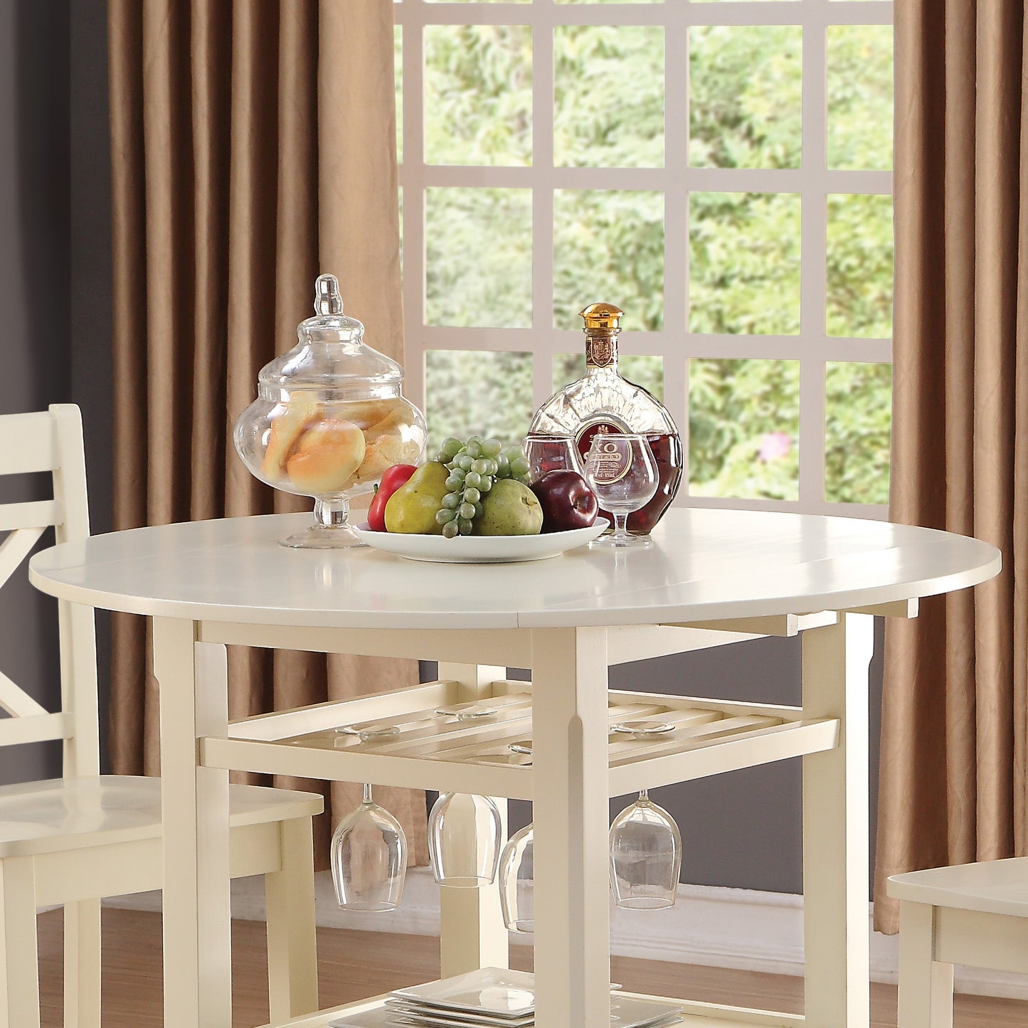 Cream kitchen island with wine glass rack and bar cart perfect for small spaces
