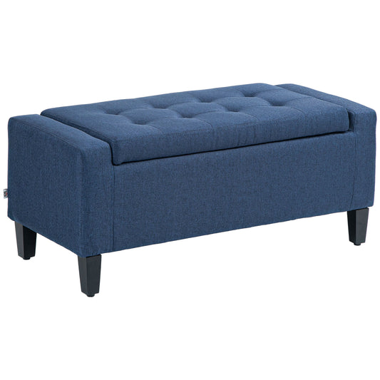 Blue fabric storage ottoman with tufted lid and dark legs