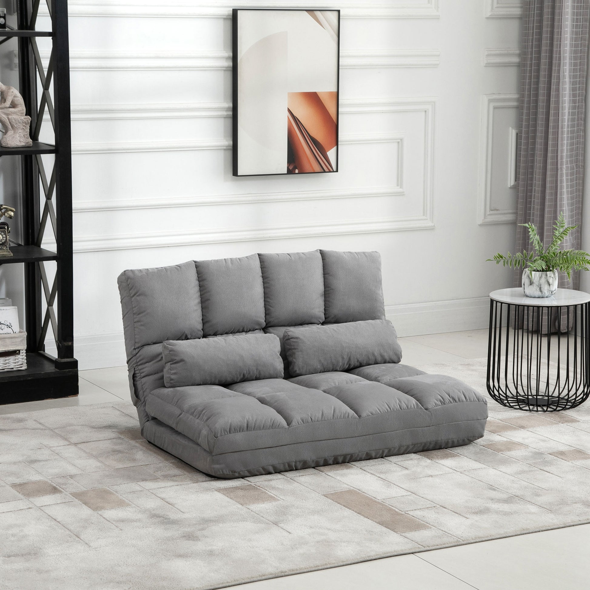 Grey fabric convertible sofa bed with plush cushions ideal for small spaces