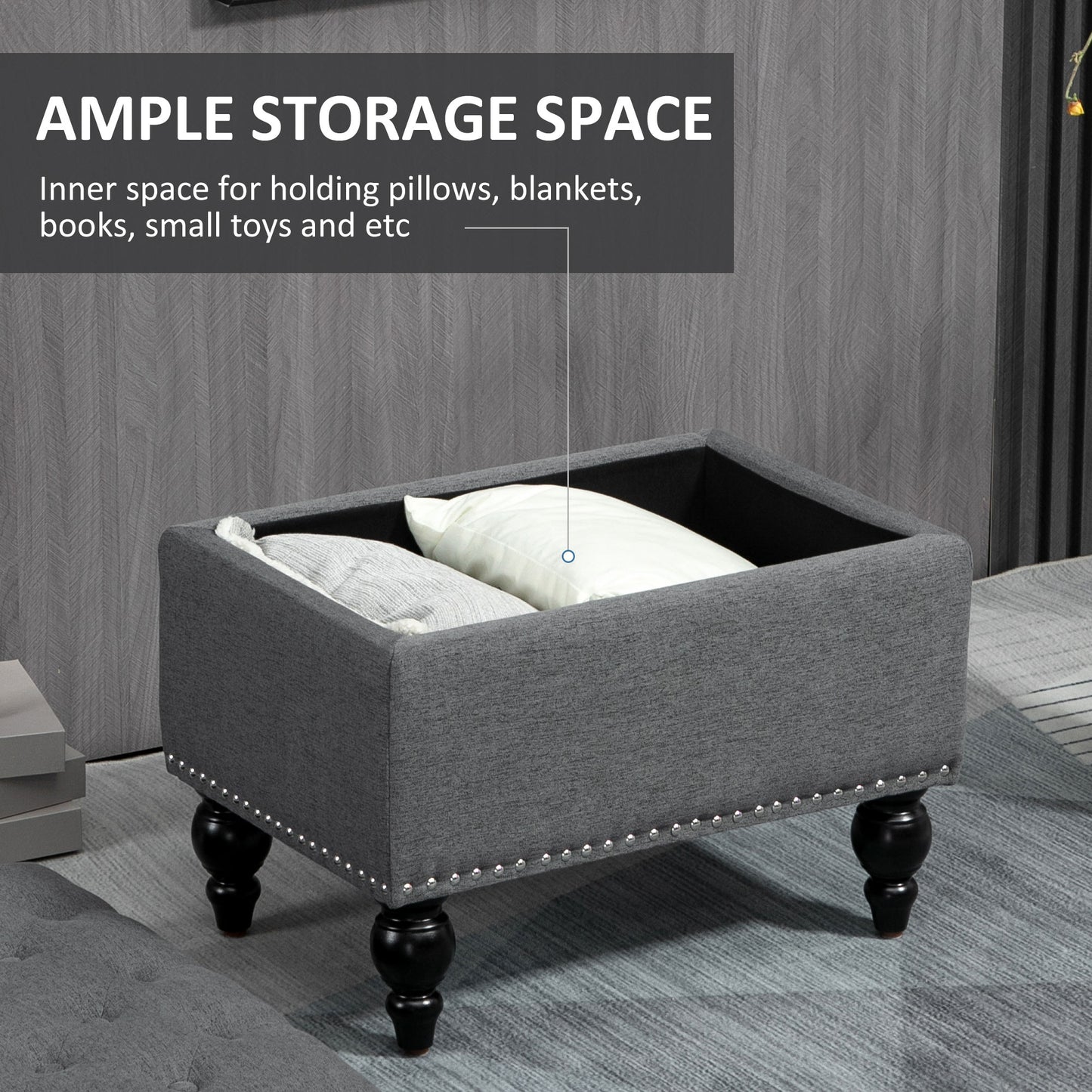 Gray fabric storage ottoman with ornate legs and silver nailhead trim