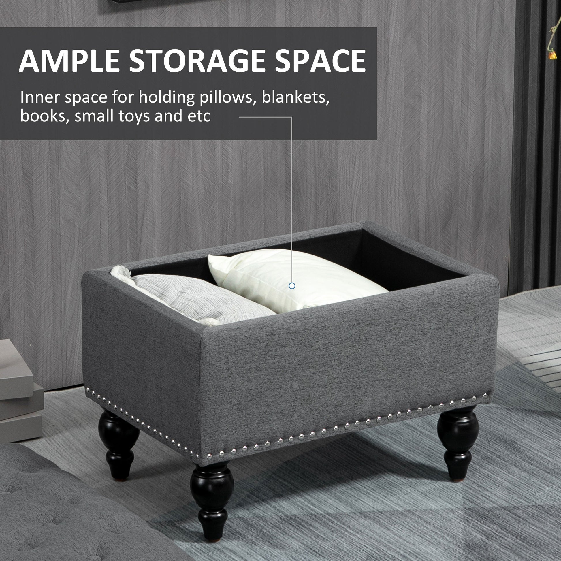 Gray fabric storage ottoman with ornate legs and silver nailhead trim