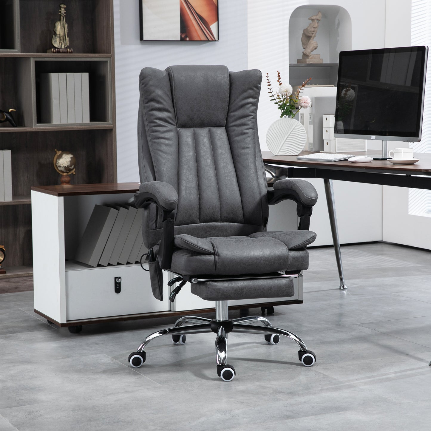 Executive massage office chair in dark gray faux leather with a footrest