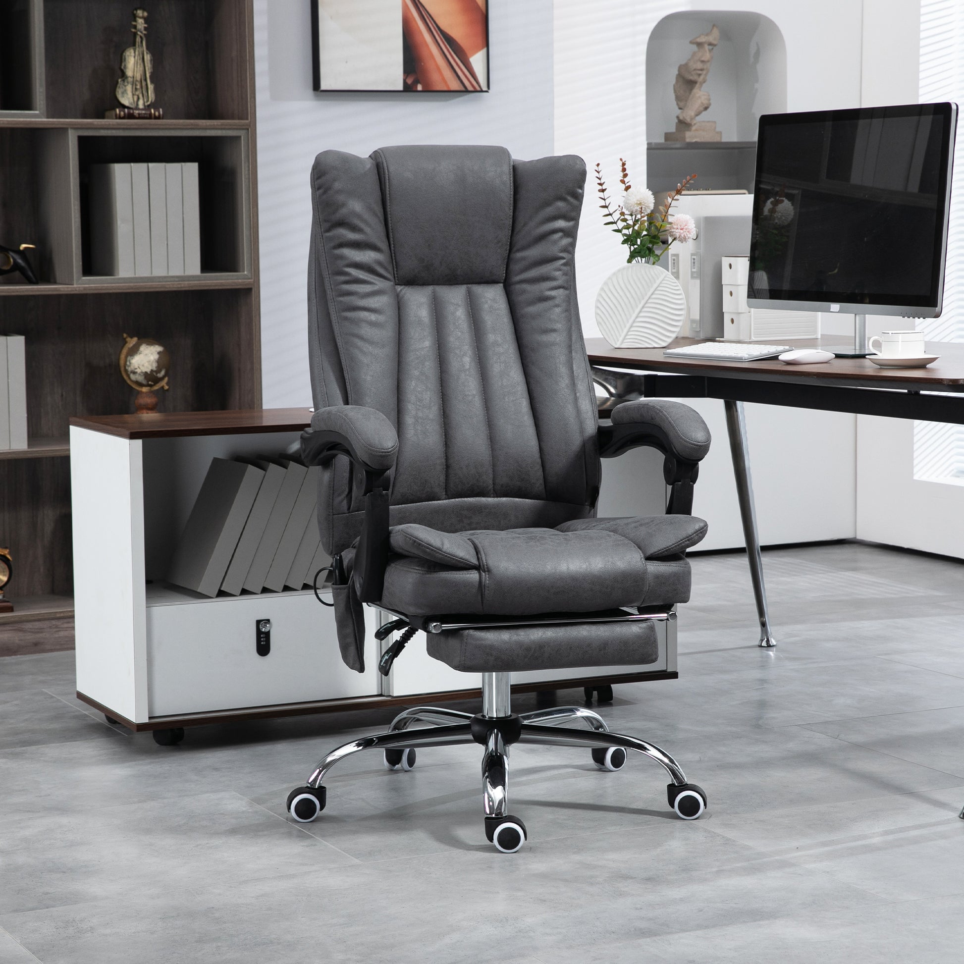 Executive massage office chair in dark gray faux leather with a footrest