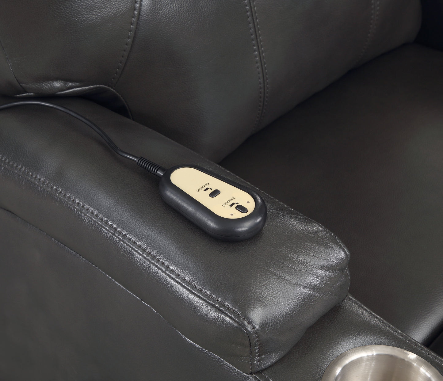 Dark gray leather recliner remote with Extended and Retracted buttons