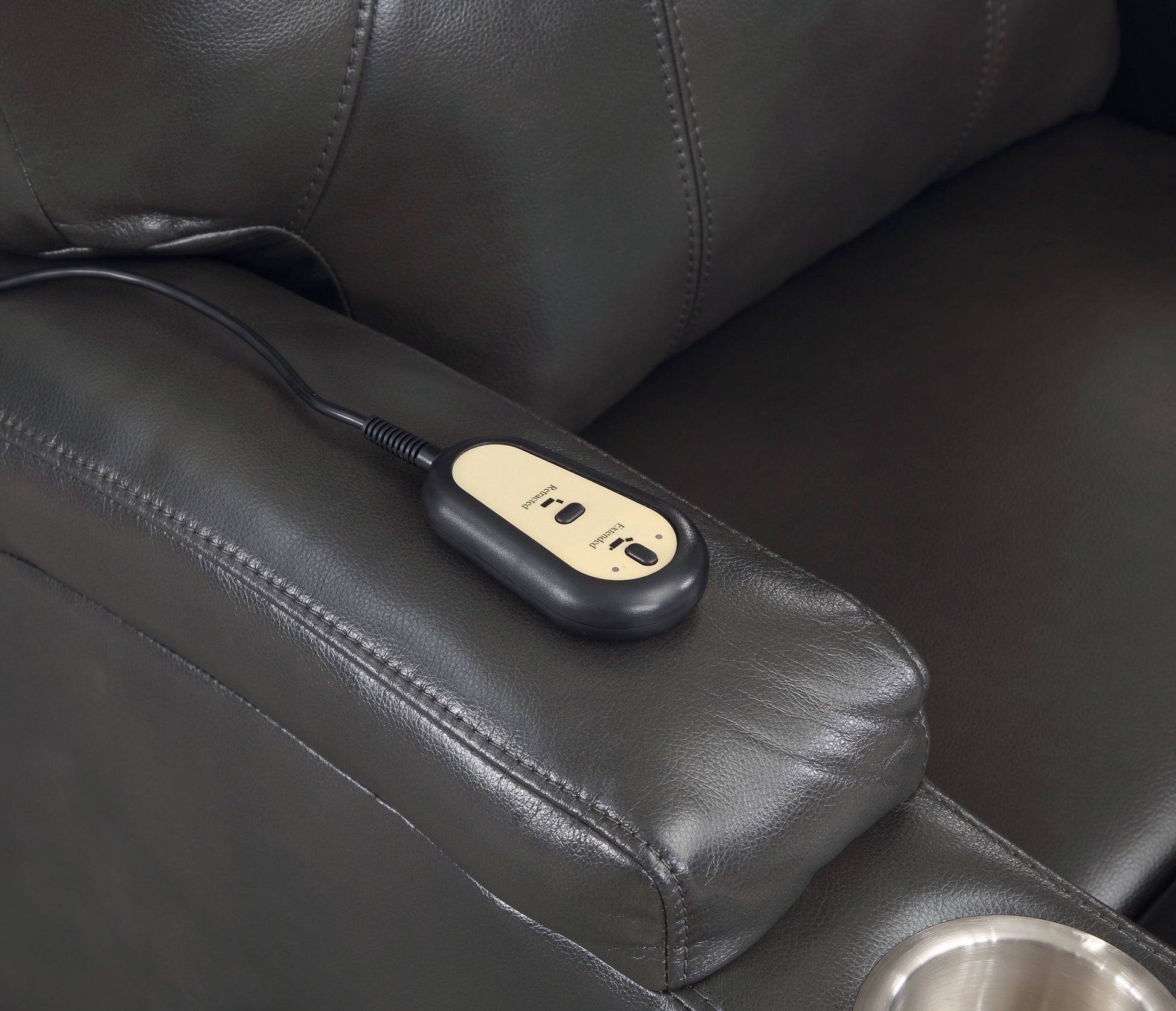 Dark gray leather recliner remote with Extended and Retracted buttons