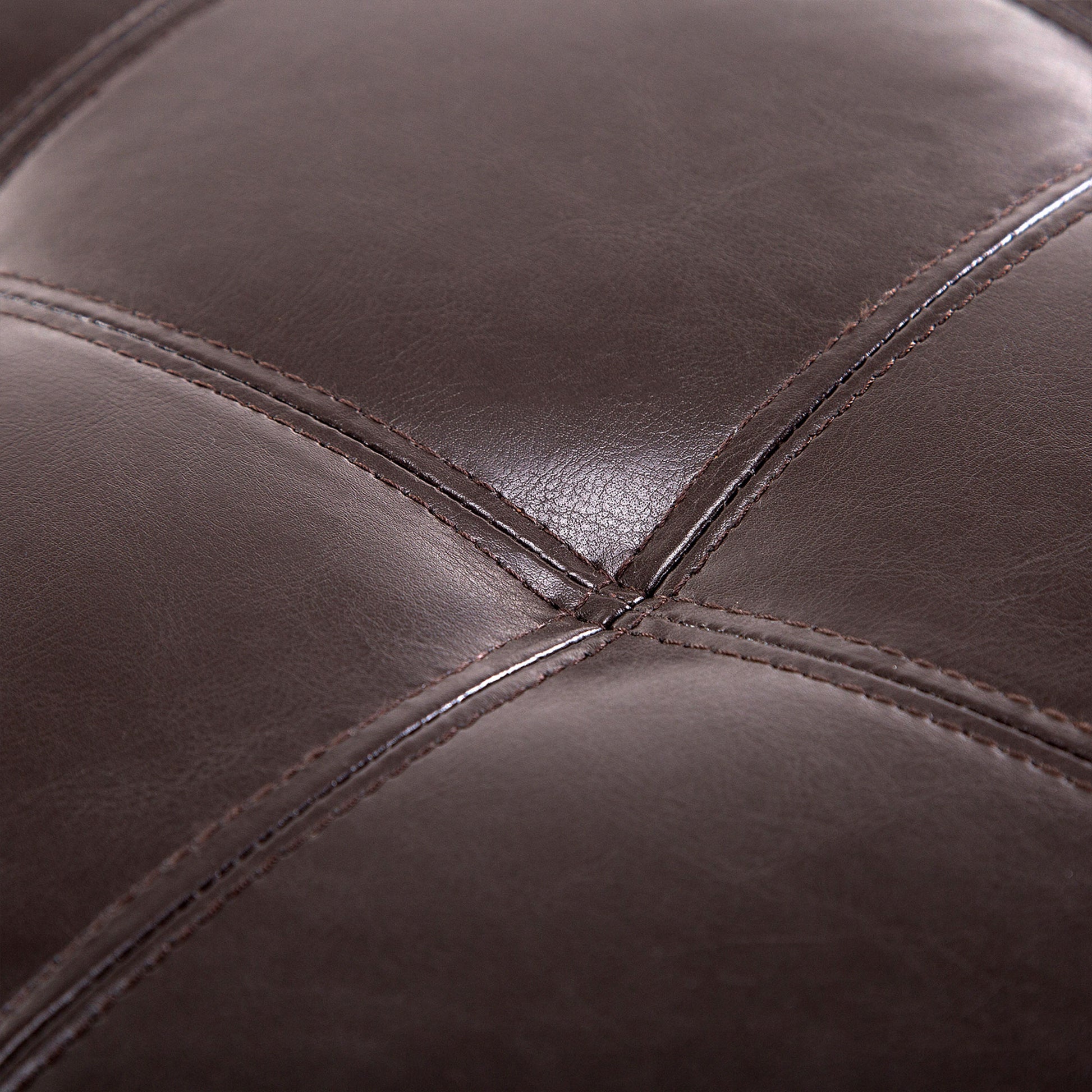 Brown faux leather tufted ottoman detail showing diamond stitching pattern