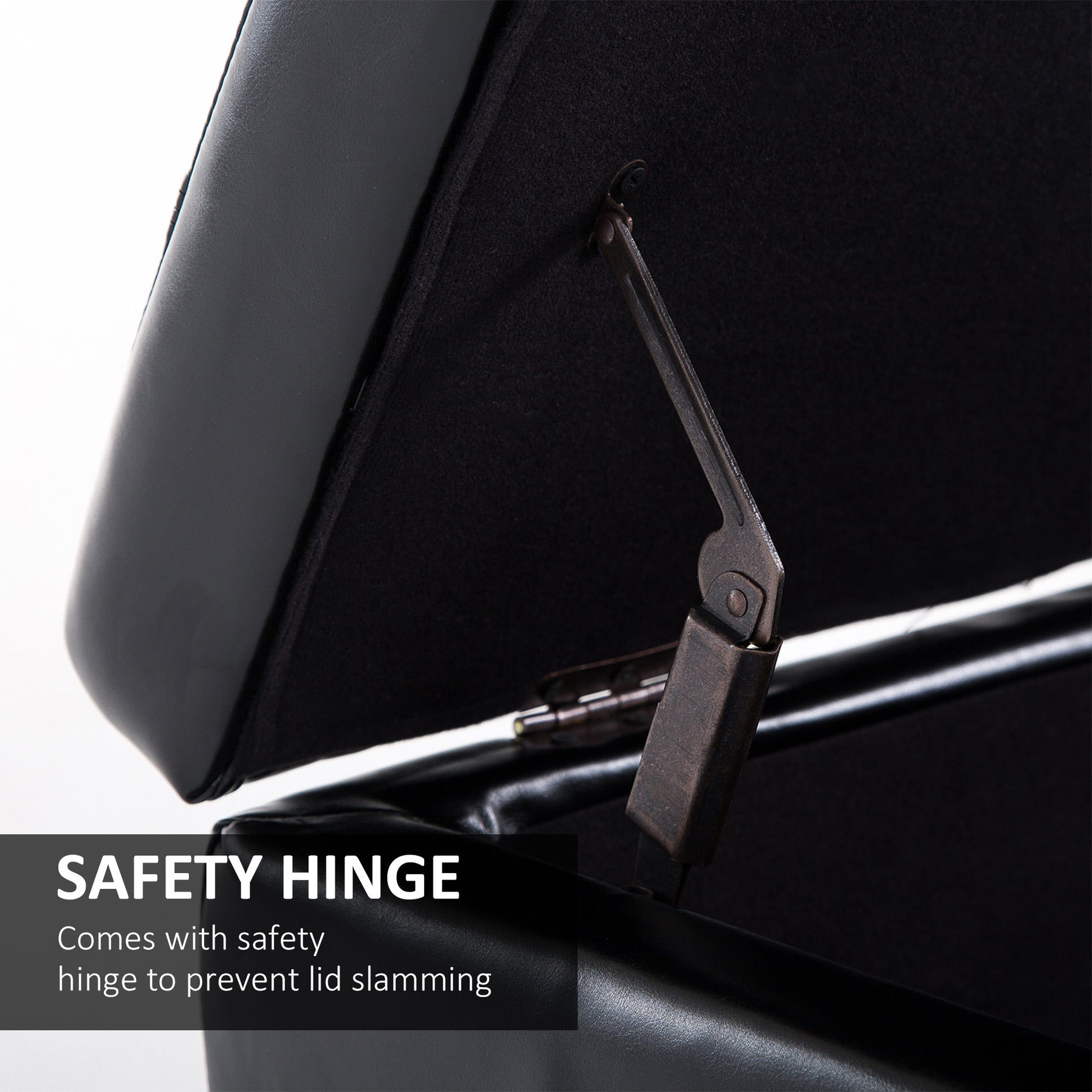 Black leather storage ottoman with safety hinge feature